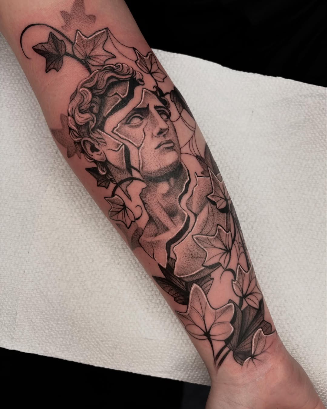 Medusa head black and grey tattoo on the forearm by Avery Mullins
