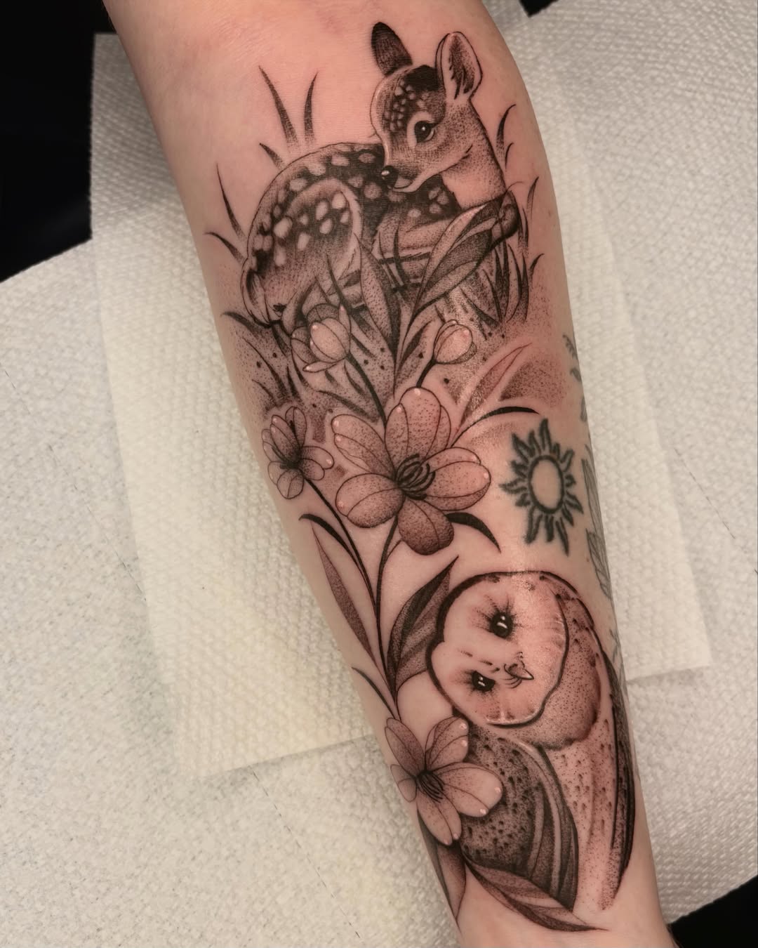 Deer and baby realism tattoo on the forearm by Avery Mullins