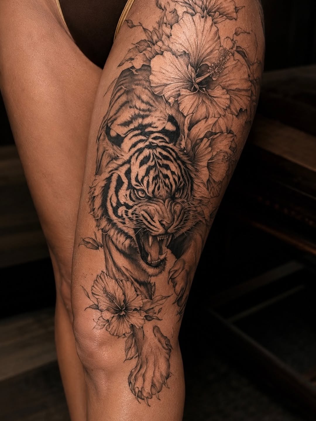 Tiger and hibiscus flowers realism tattoo on the thigh by Tattoo Artist Miami & la, Hollywood, Florida