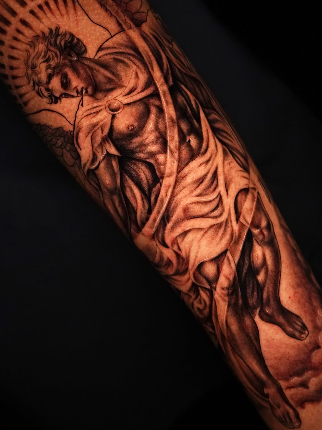 Angelic figure realism tattoo on the forearm by Jennifer Garcia