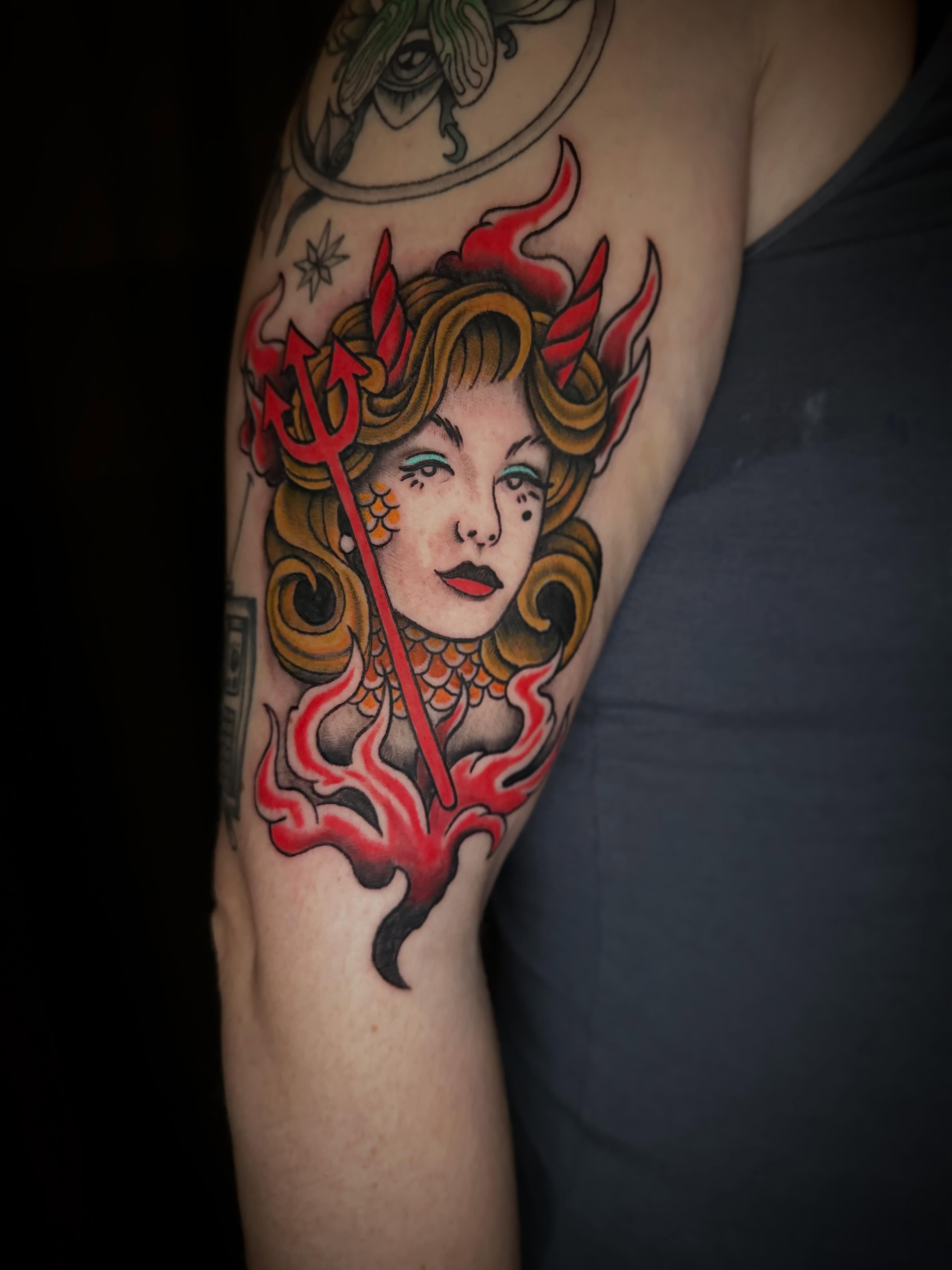 Woman with trident American traditional tattoo on the forearm by Lindsey Bendsey