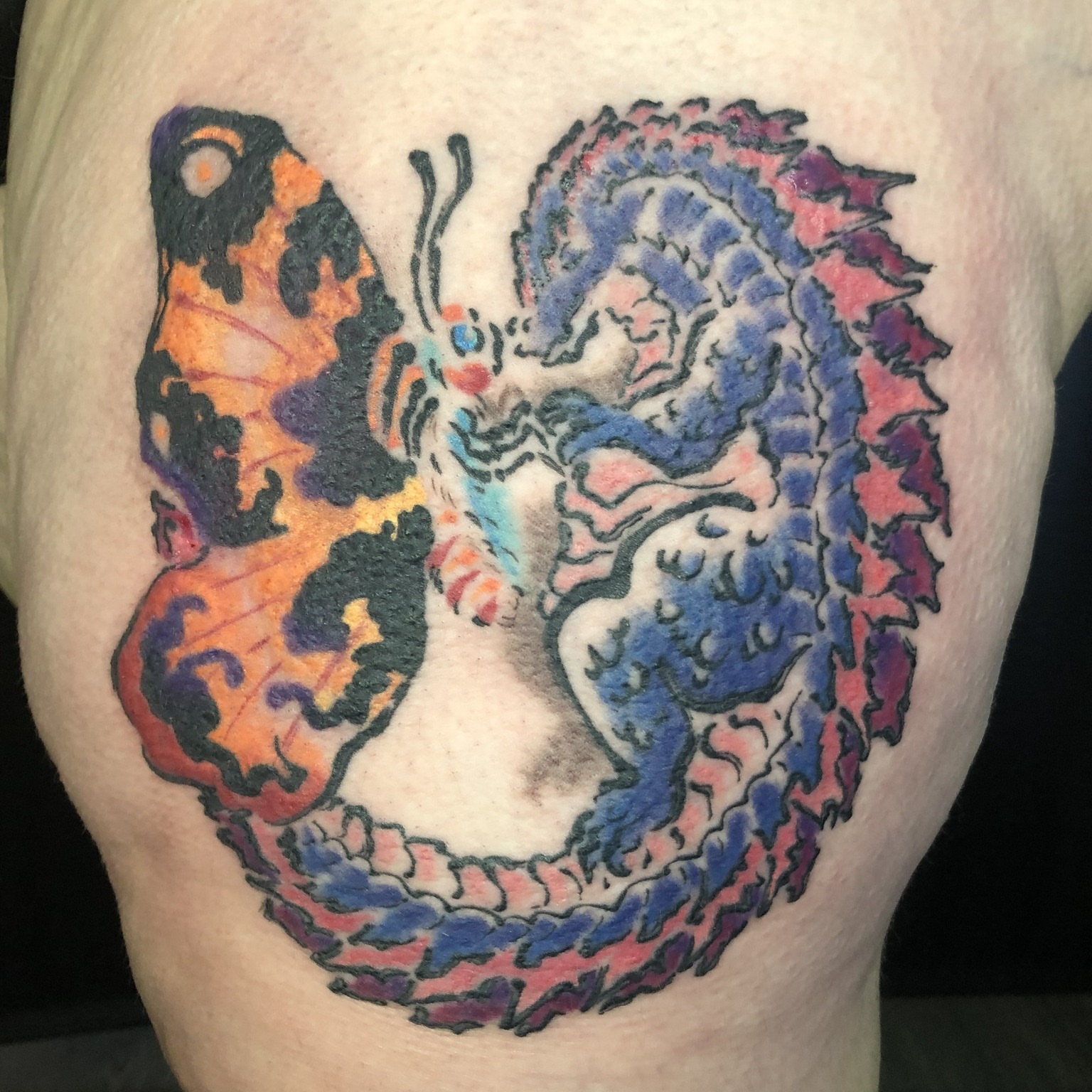 Dragon and butterfly dotwork tattoo on the thigh by Rowan Lee