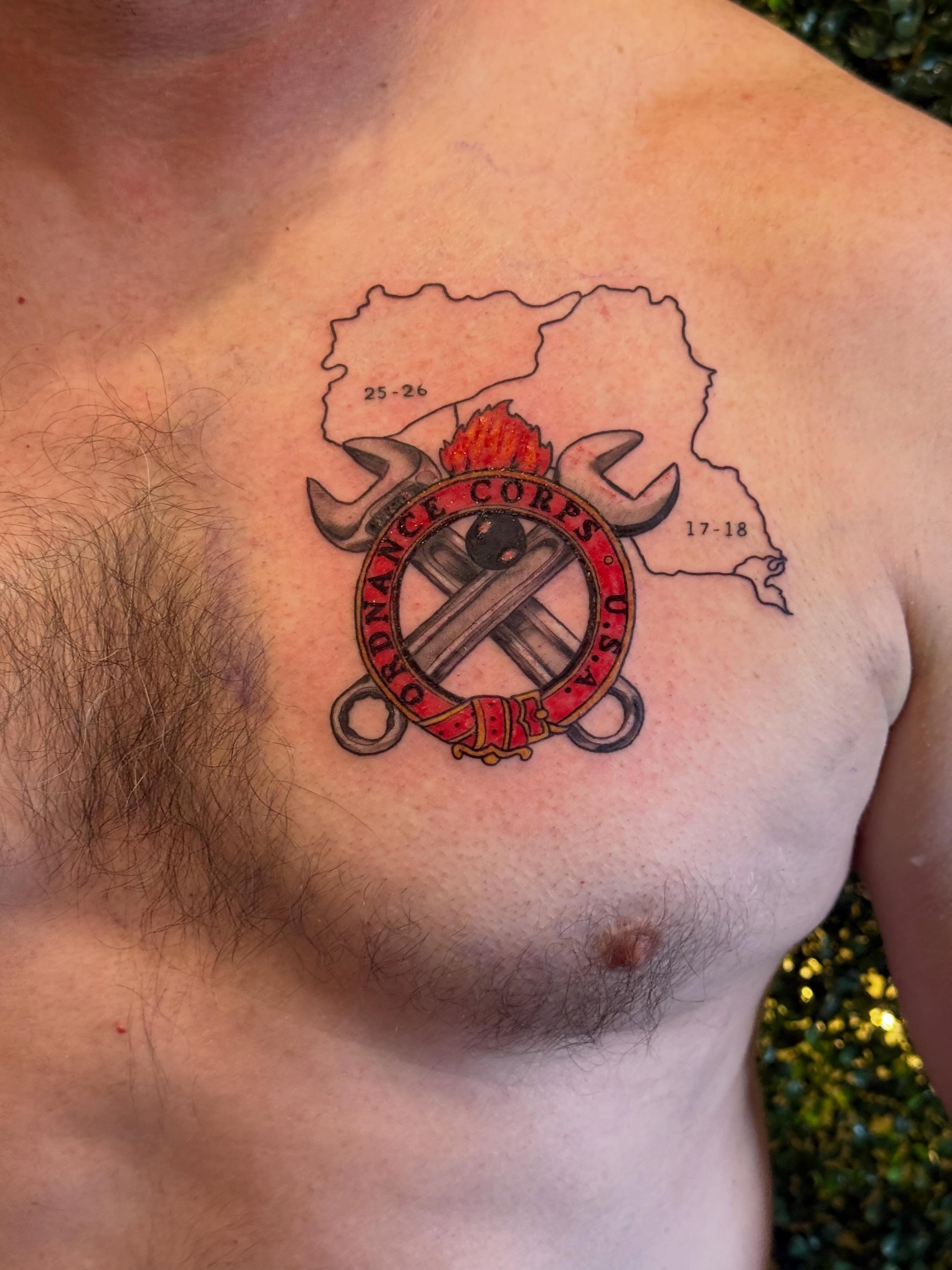 Ordnance corps emblem American traditional tattoo on the chest by Lauren Horness
