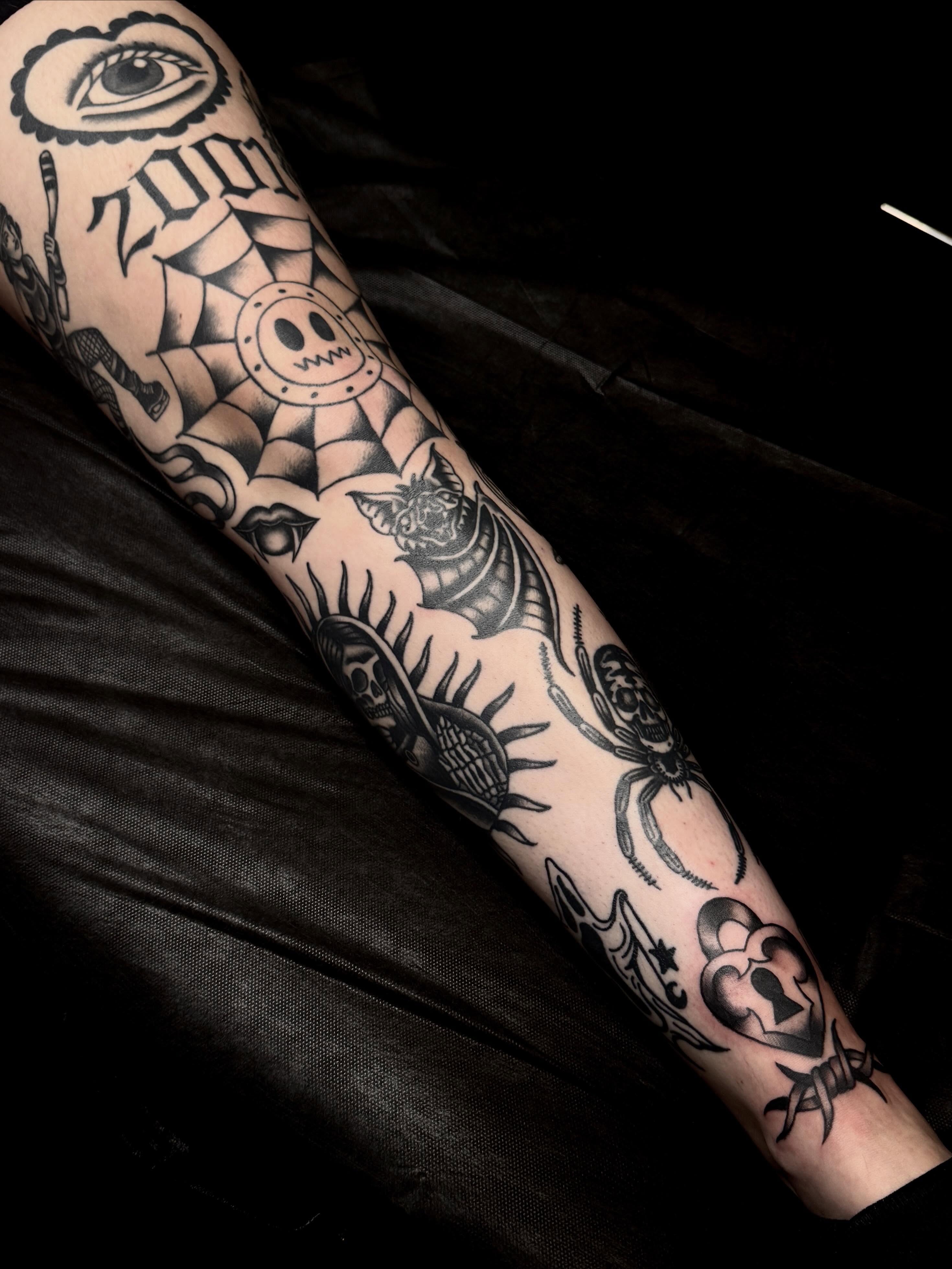 Skull and spider American traditional tattoo on the forearm by Meg Nefcy, Milford, Michigan