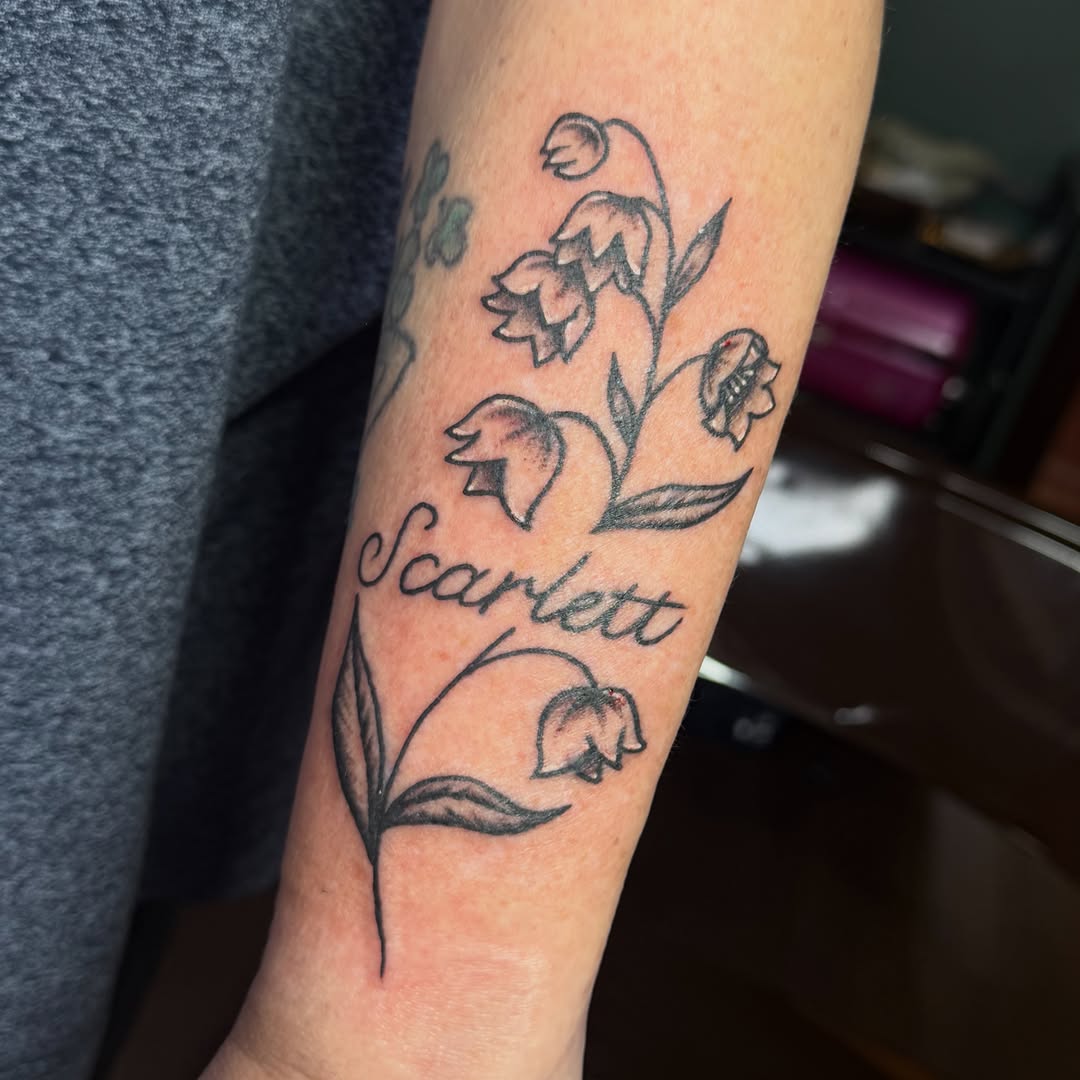 Lily of the valley black and grey tattoo on the forearm by abbey pickens 🧚 cleveland ohio