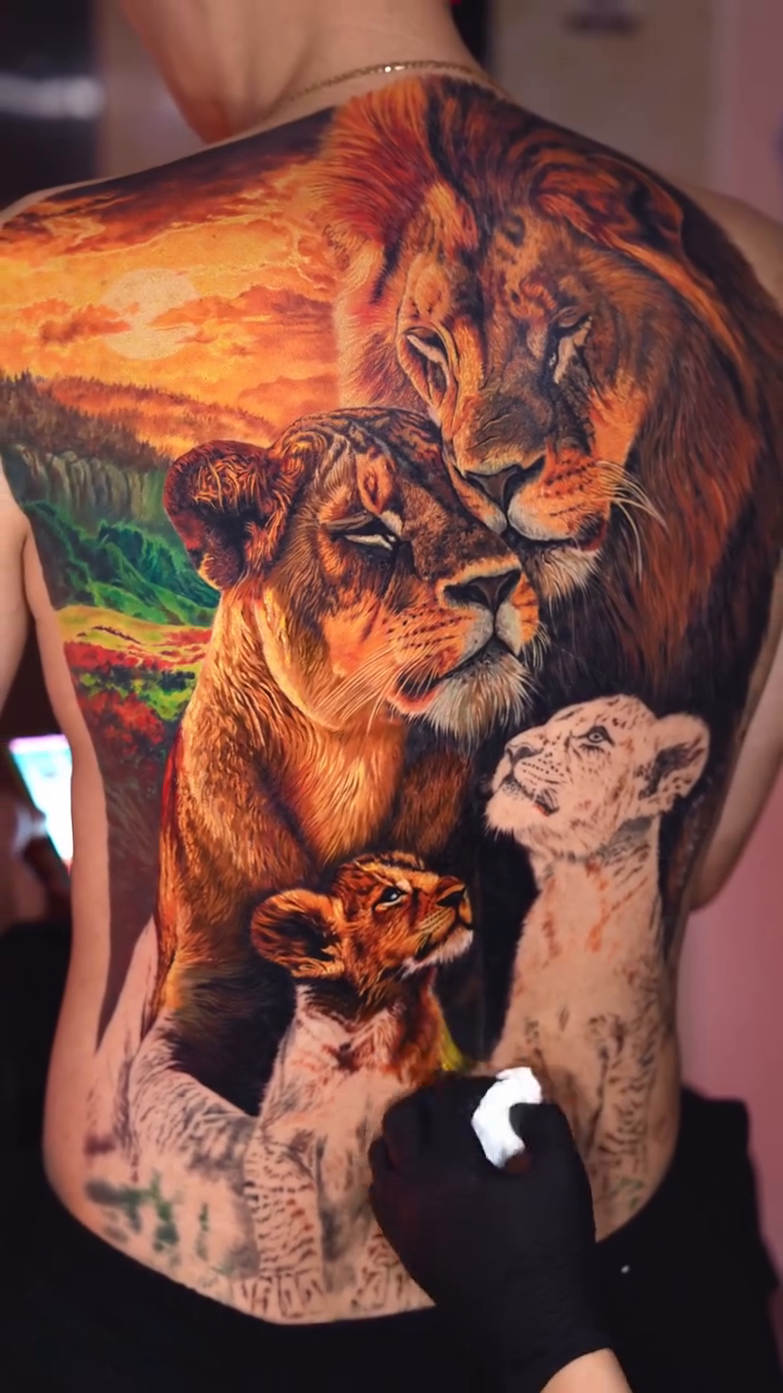 Lion family with cubs at sunset realism tattoo on the back by Bình Nguyễn