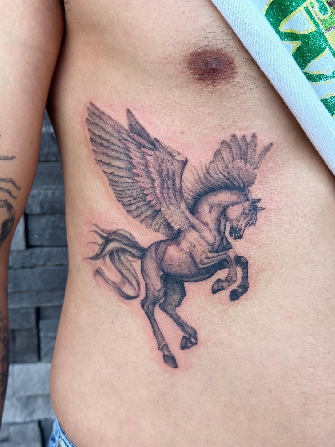 Tattoo by @heliast.tattoos — realism, black_and_grey