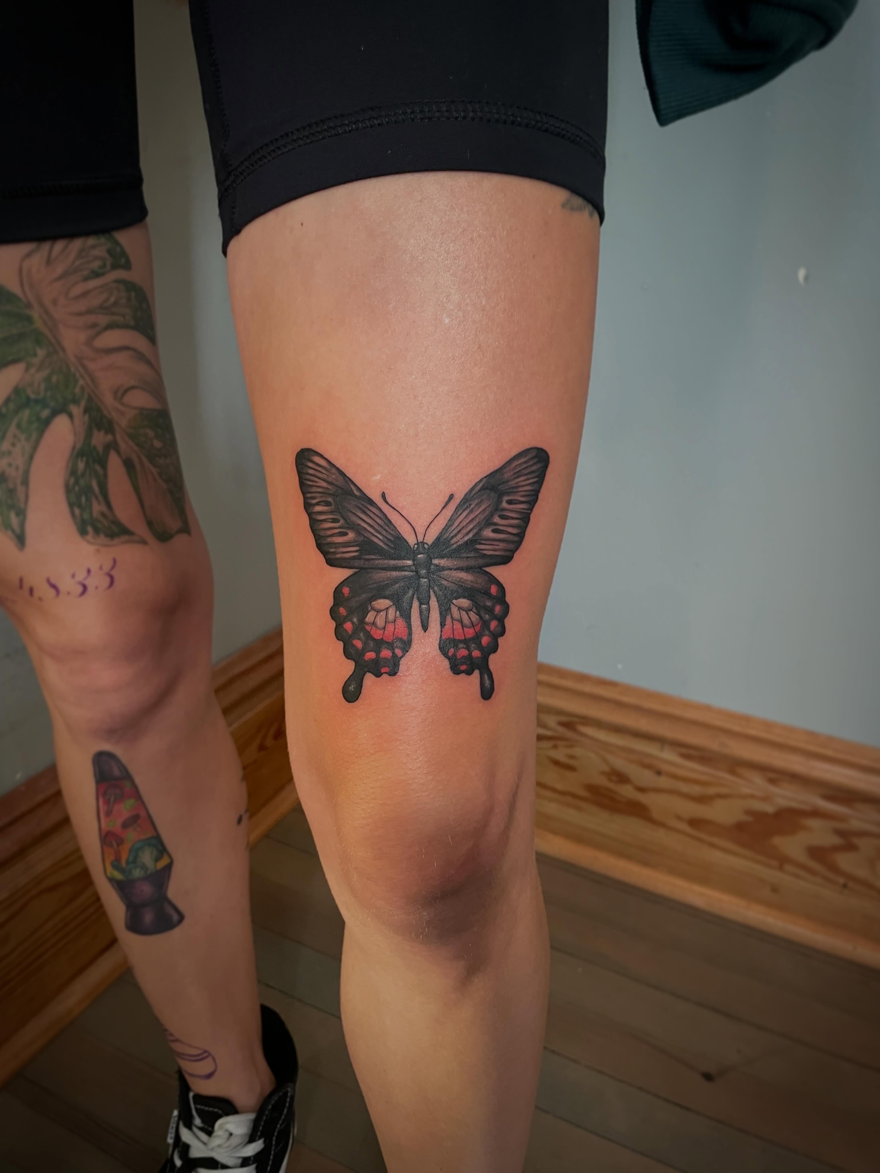 Butterfly realism tattoo on the leg by Hannah Copeskey