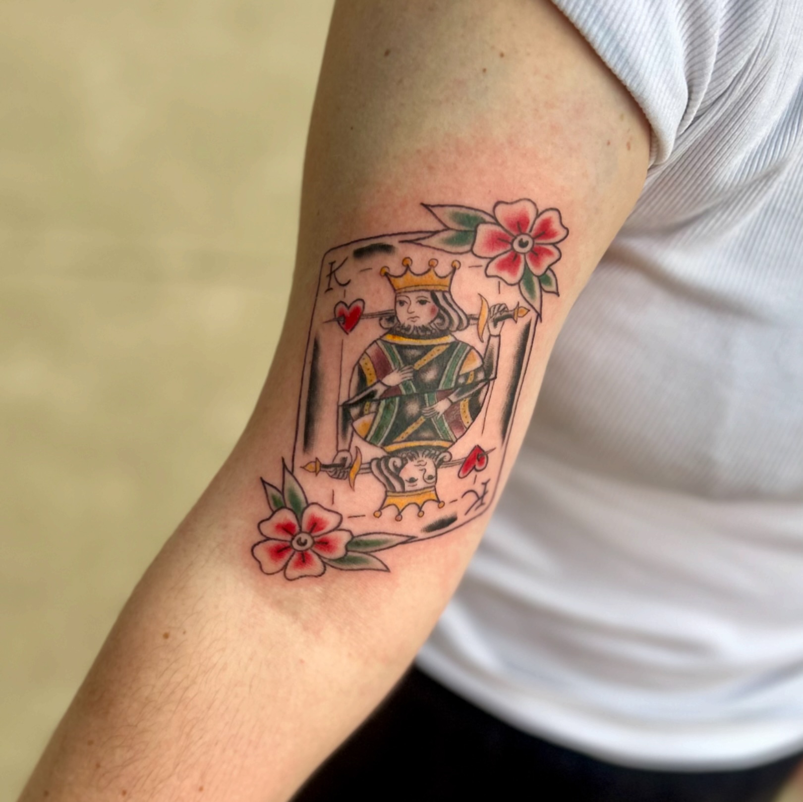 King of hearts American traditional tattoo on the forearm by Tori Magill