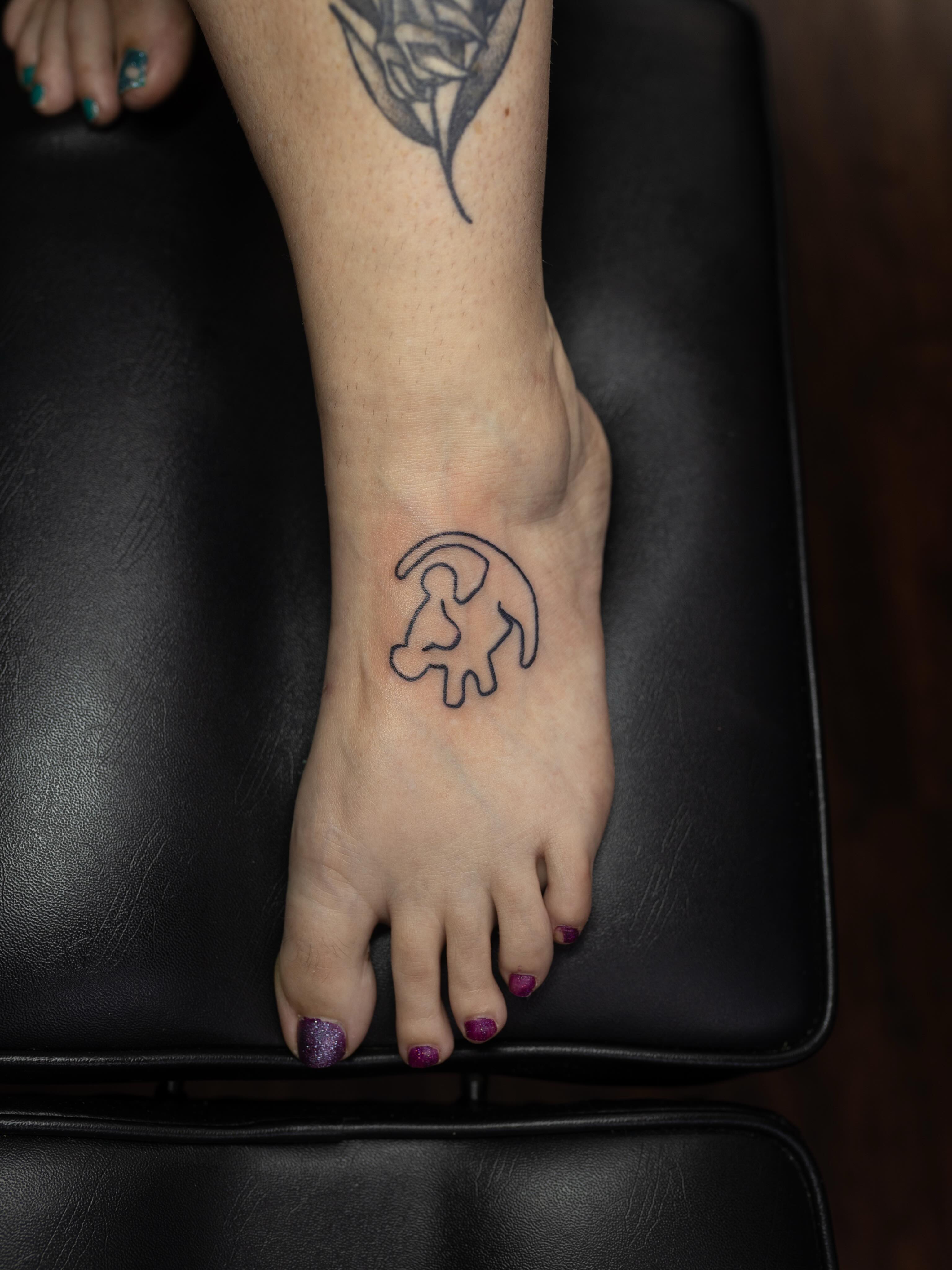 Goat minimalist tattoo on the foot by Kelsie