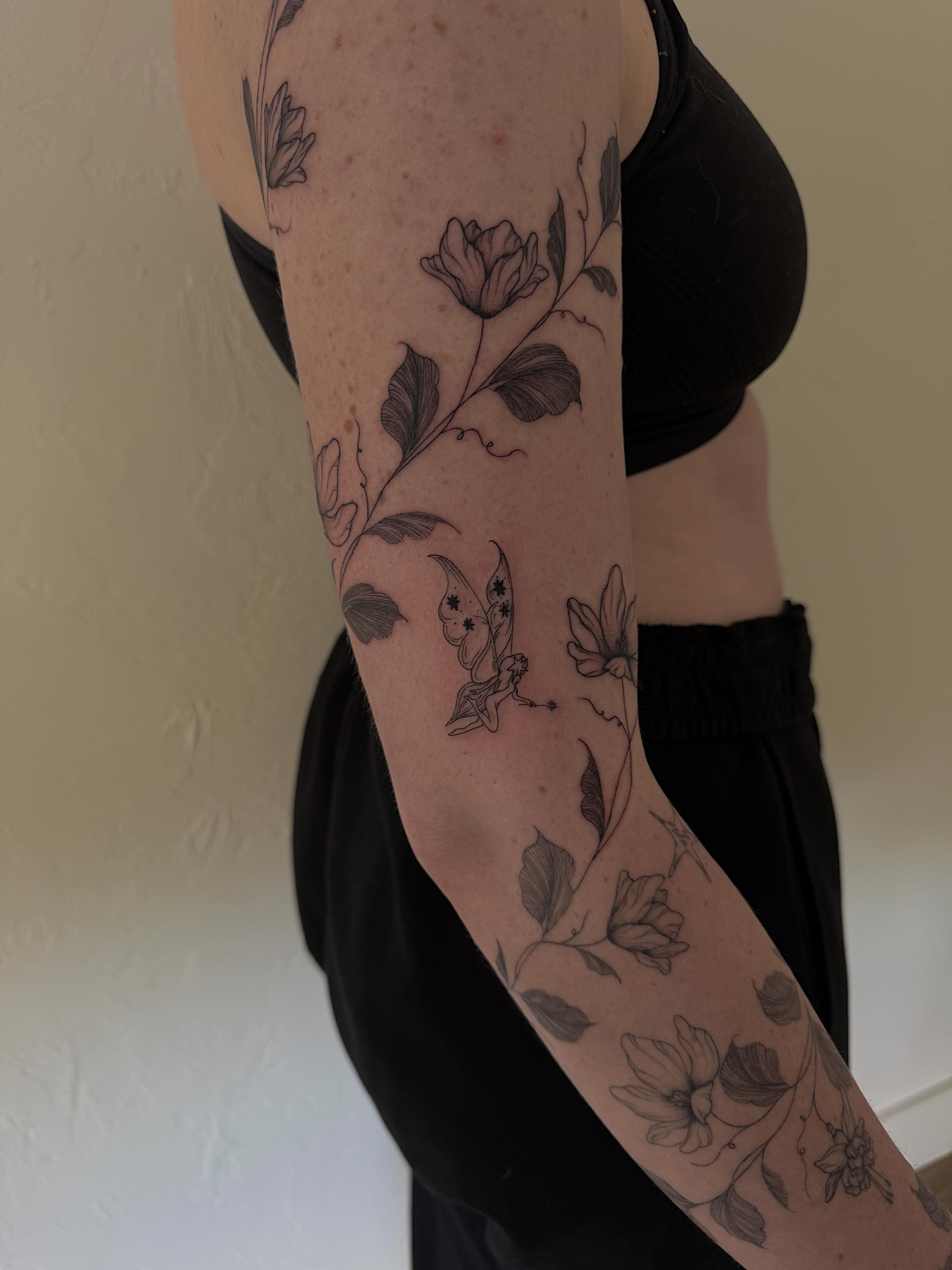 Floral and butterfly black and grey tattoo on the forearm by Shelby Lynn Bayles, Ogden, Utah