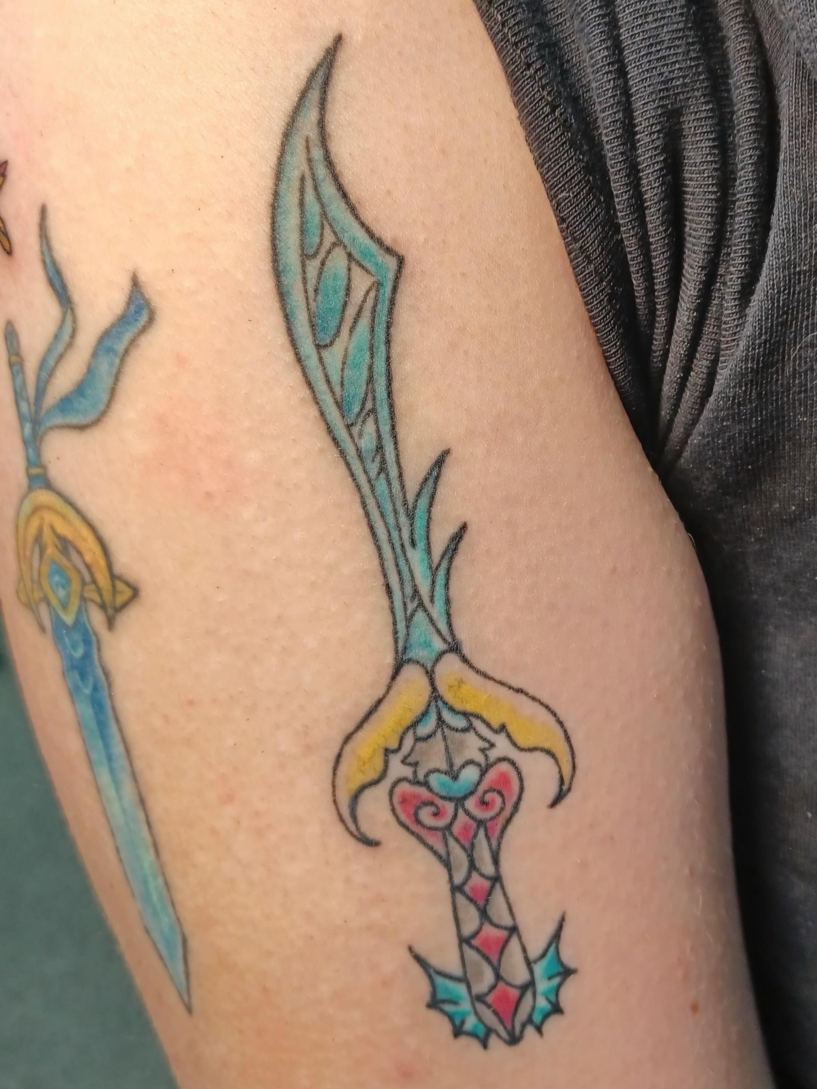 Sword geometric tattoo on the forearm by Abi