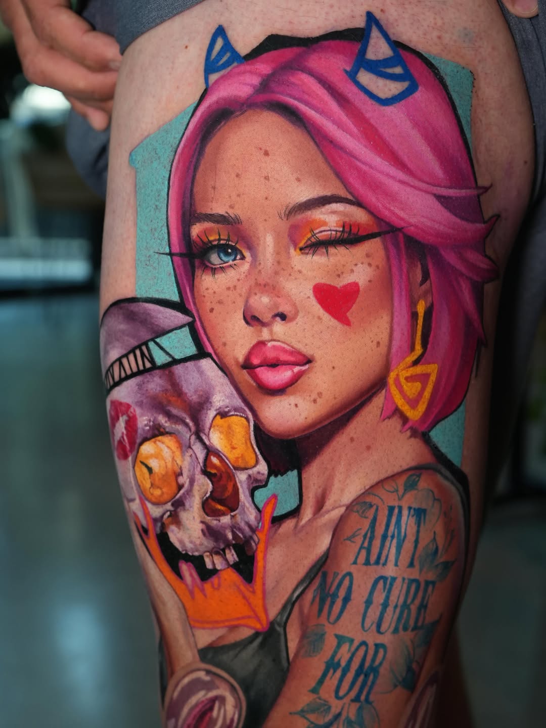 Girl holding a skull neo-traditional tattoo on the thigh by Daria Pirojenko