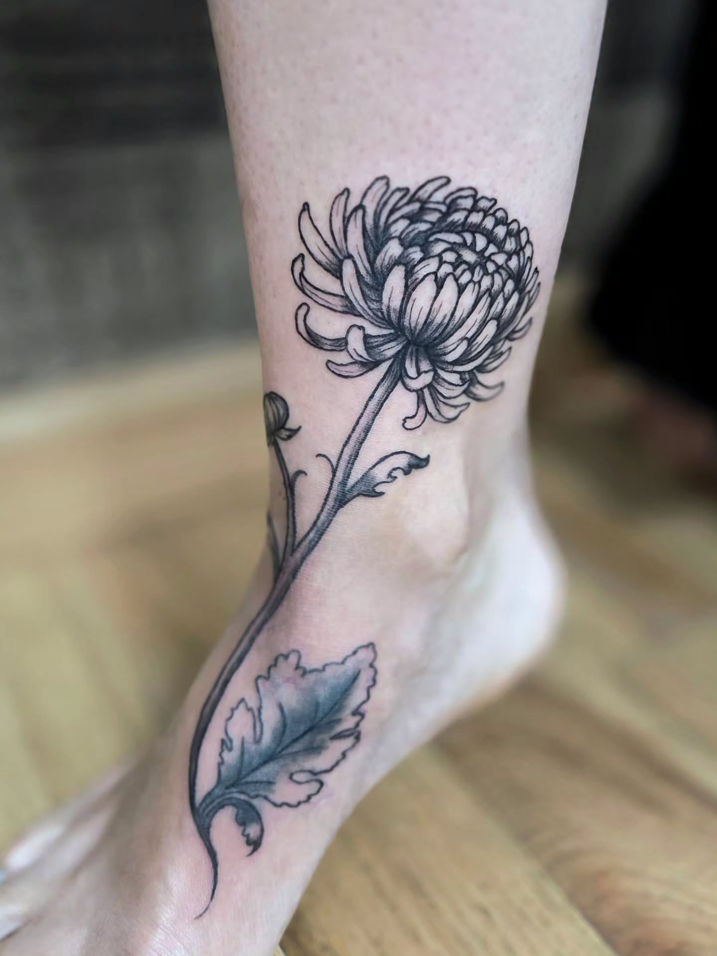 Chrysanthemum black and grey tattoo on the foot by Courtney, Lakewood, Ohio
