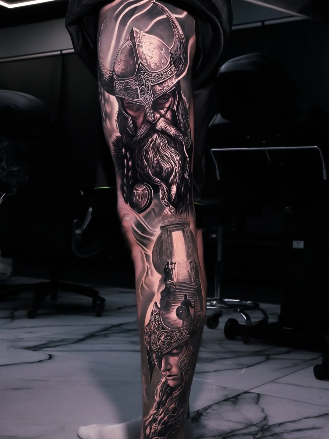 Viking warrior and warrior woman realism tattoo on the forearm by George Lange