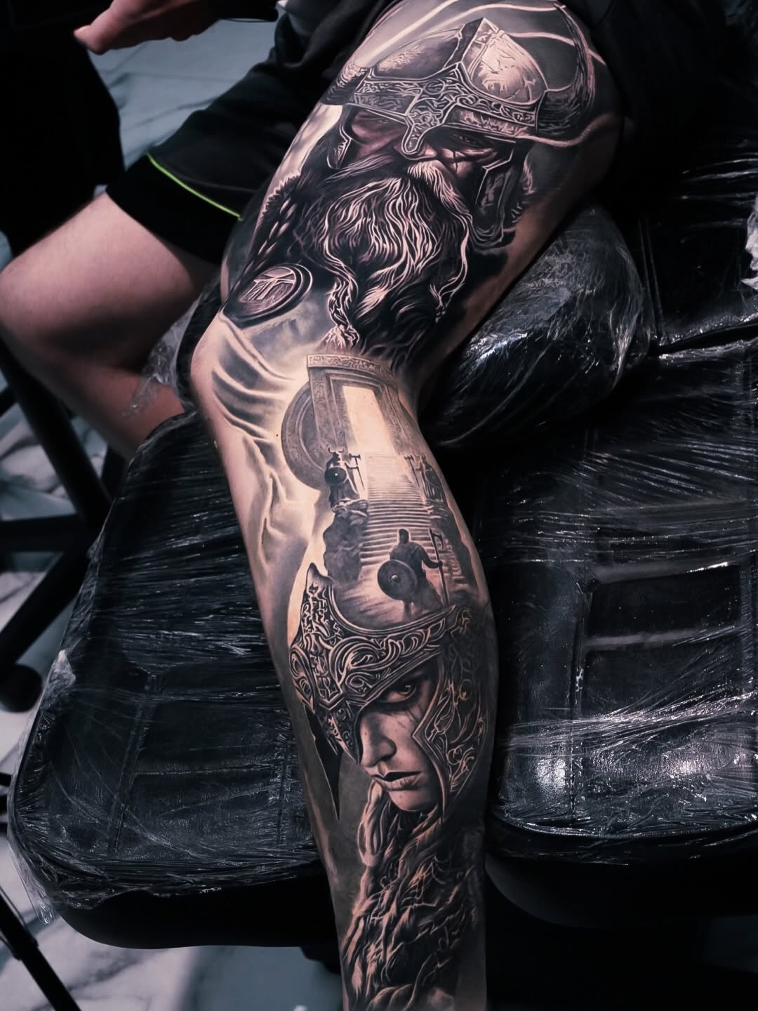 Viking warrior and woman realism tattoo on the forearm by George Lange