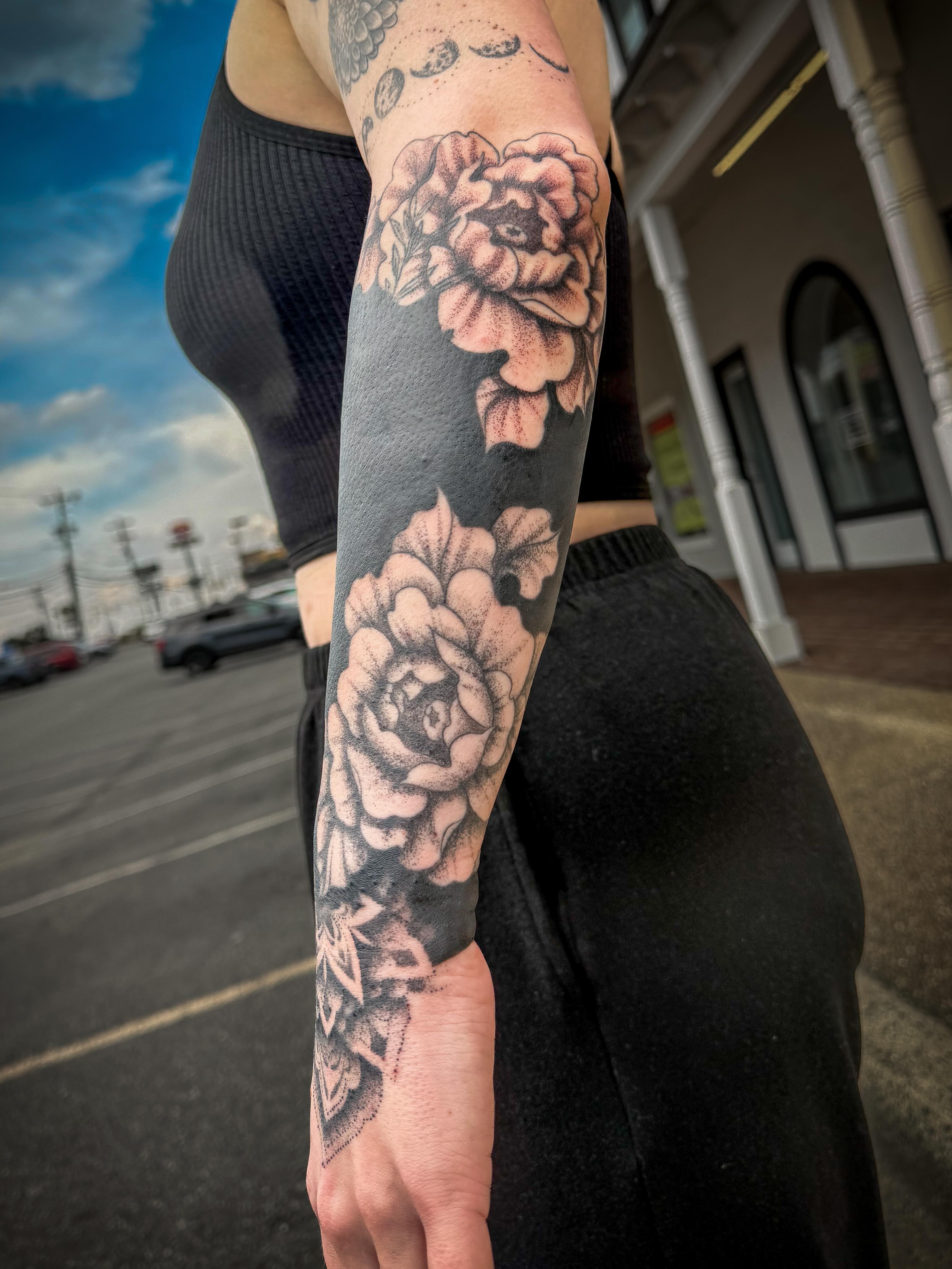 Peony flowers dotwork tattoo on the forearm by Jesse TheTerrible