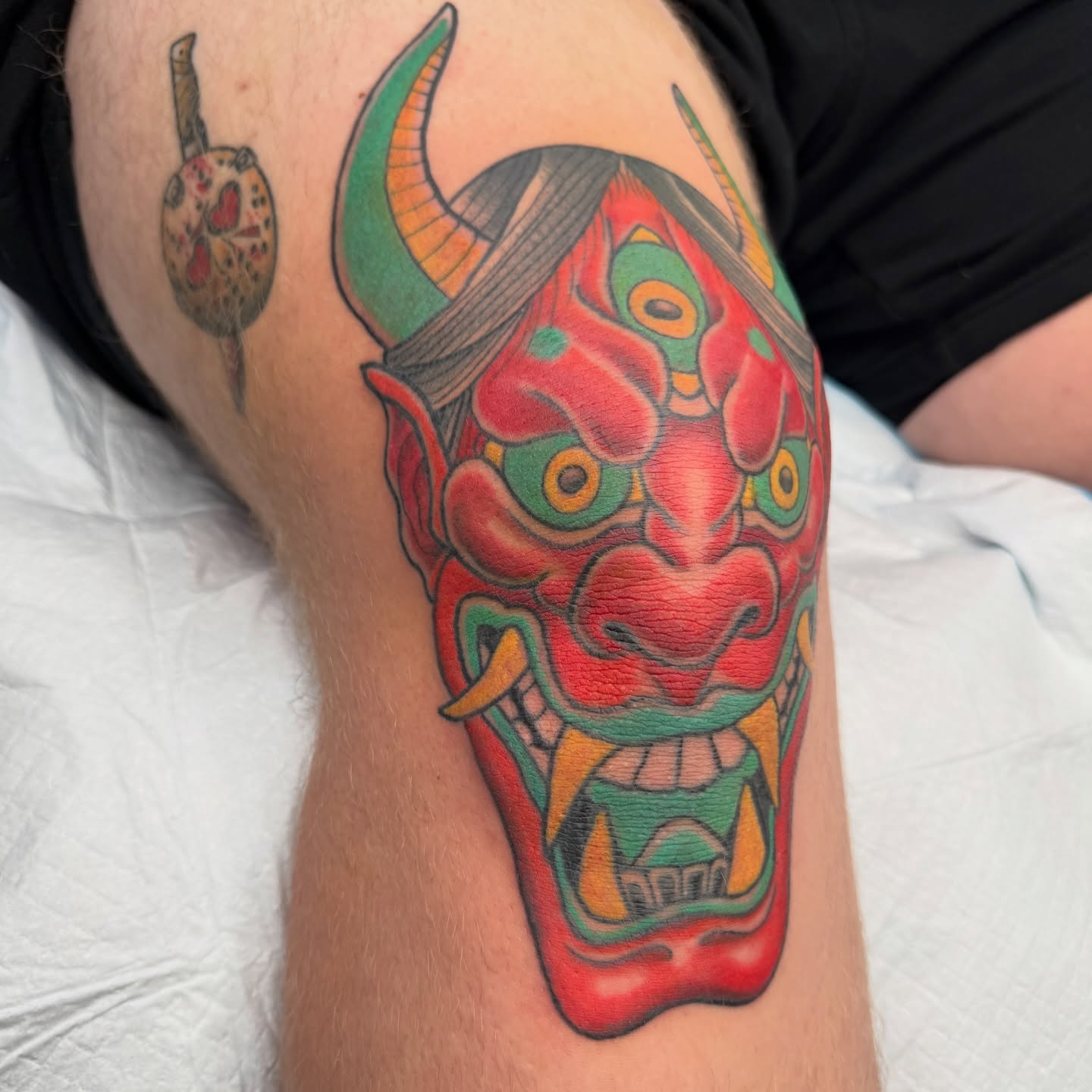 Demon mask japanese irezumi tattoo on the forearm by Joel Smith, Manhattan, Kansas