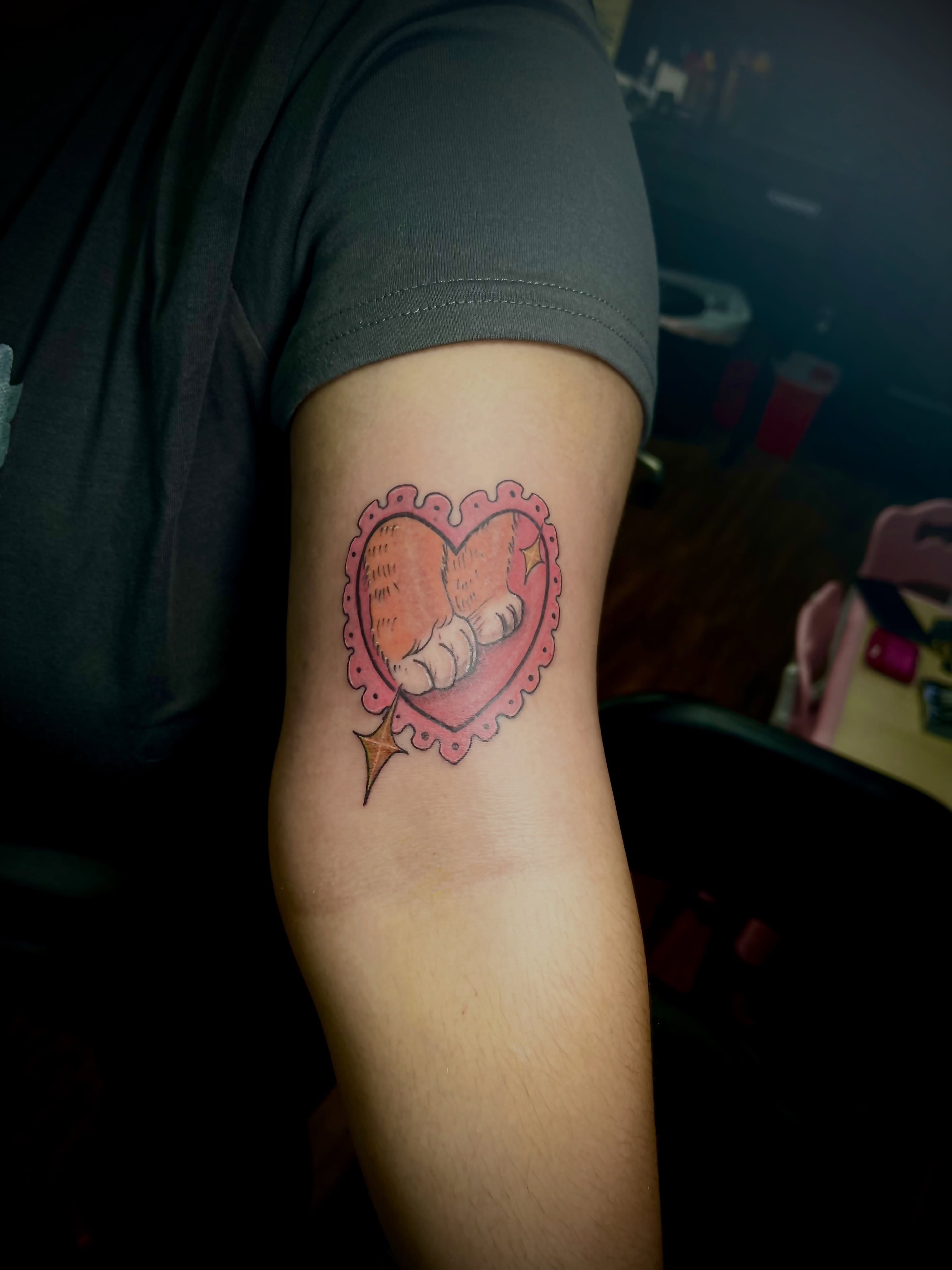Heart with hands American traditional tattoo on the forearm by Eli Flores