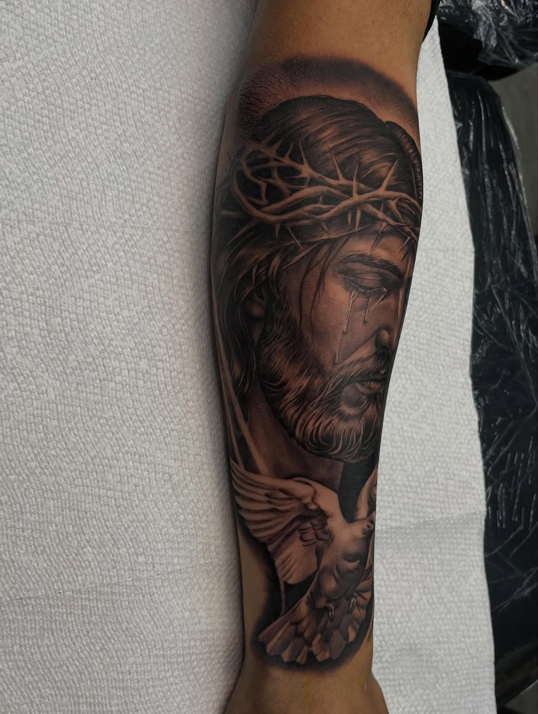 Chicano tattoo on the forearm by Denver Tattoo Artist