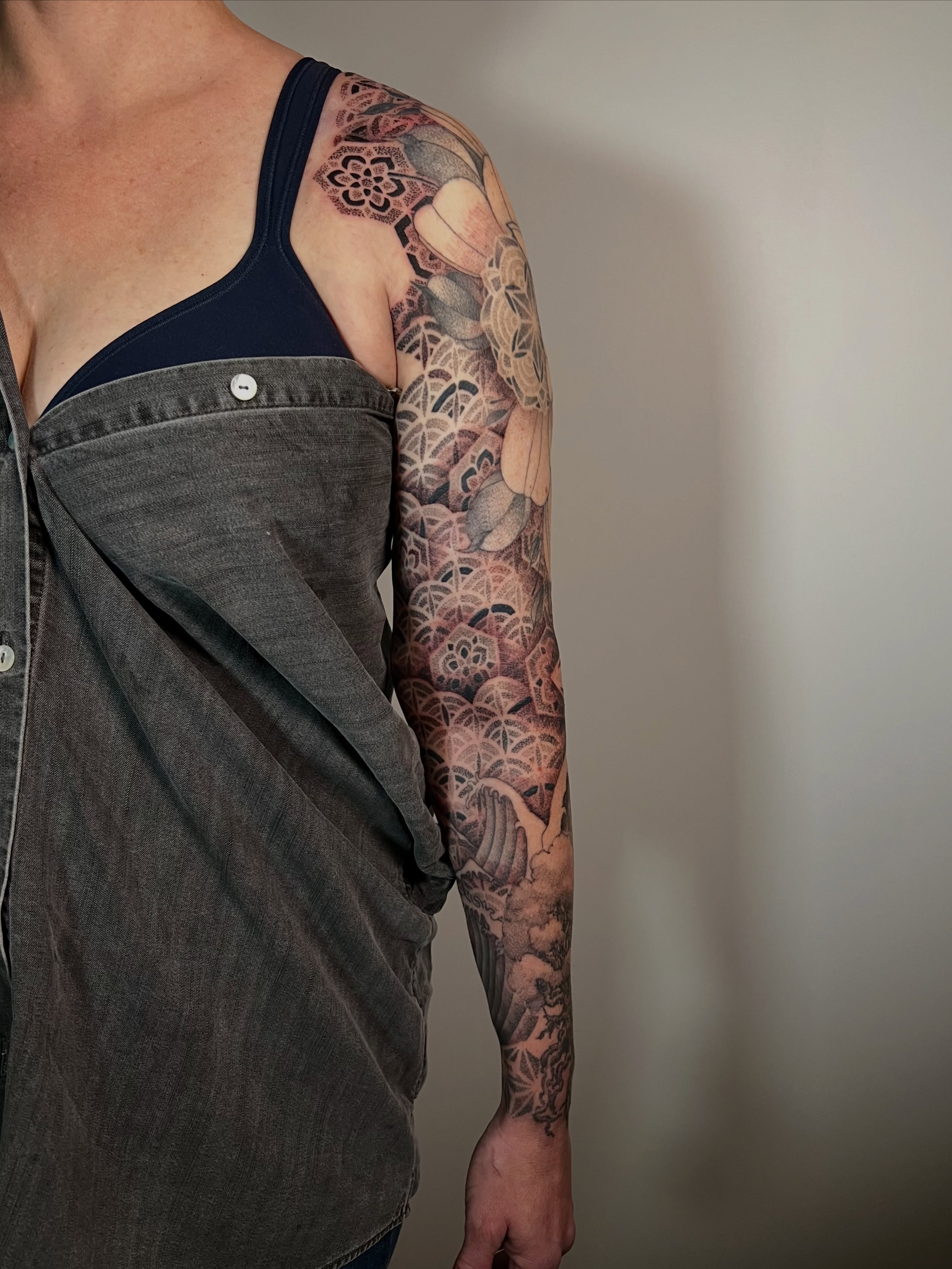Floral patterns japanese irezumi tattoo on the upper arm by Riley