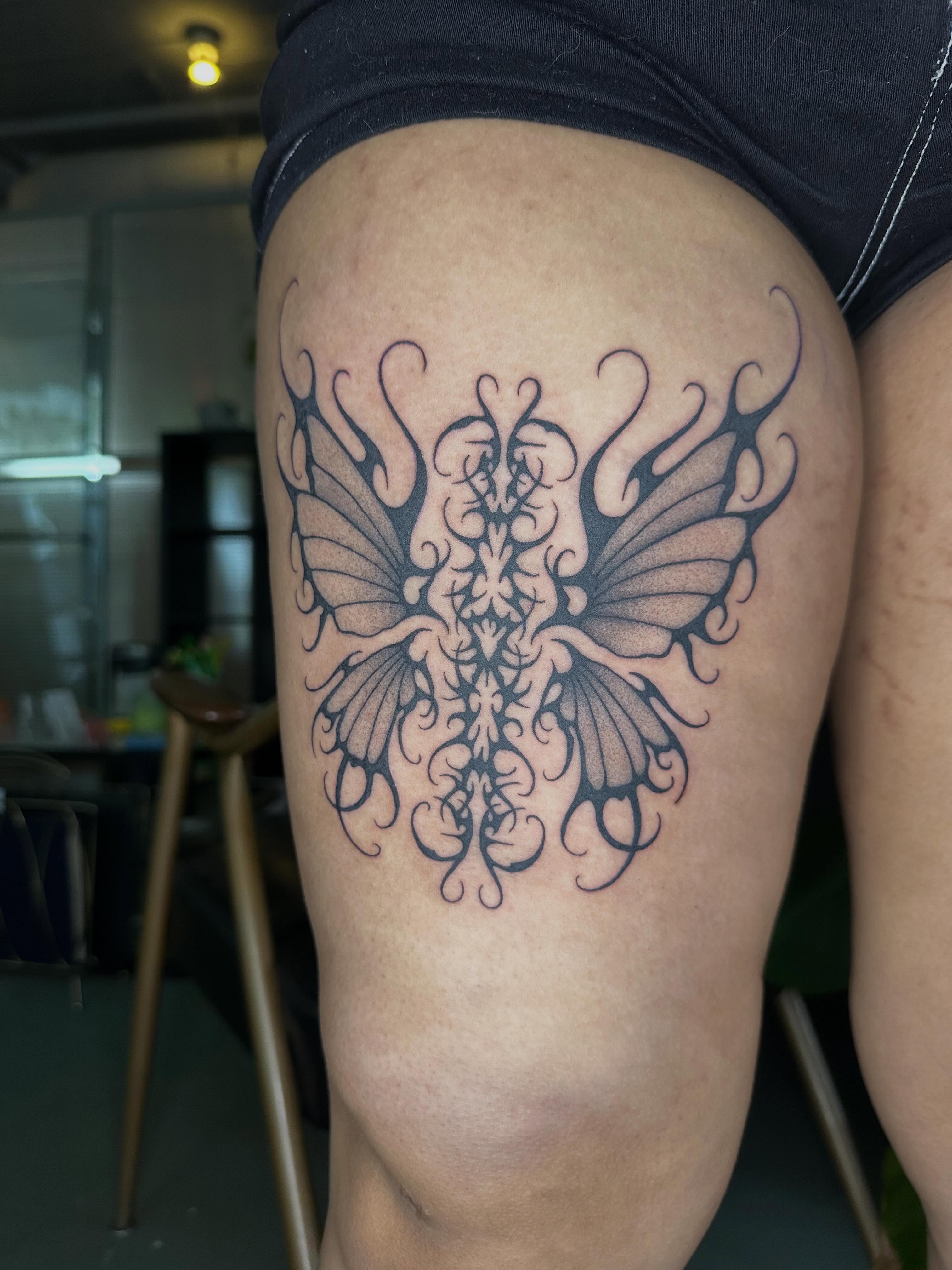 Butterfly ornamental tattoo on the thigh by 𝔠𝔞𝔯𝔯𝔦𝔢