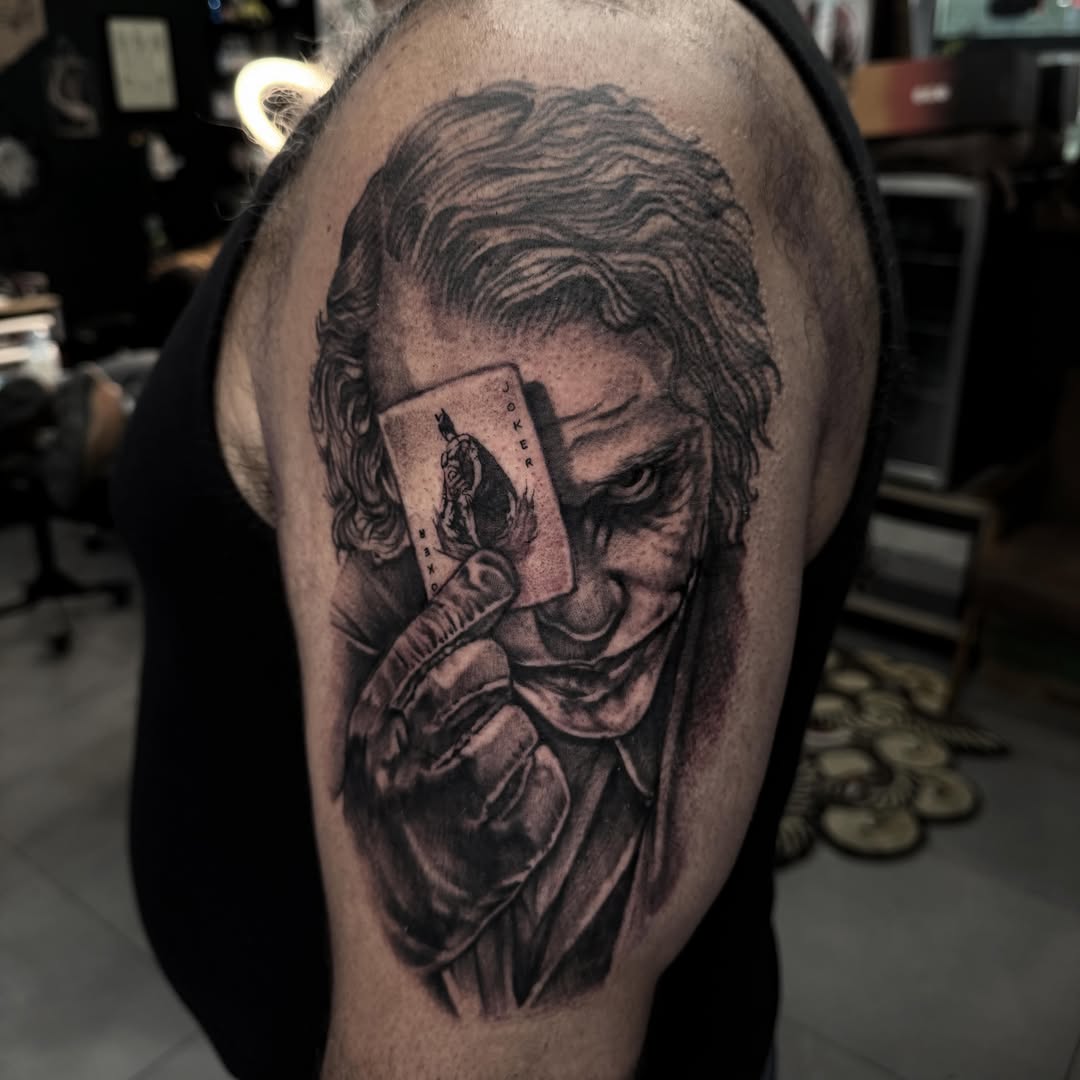 Joker realism tattoo on the shoulder by Ryan Futterman