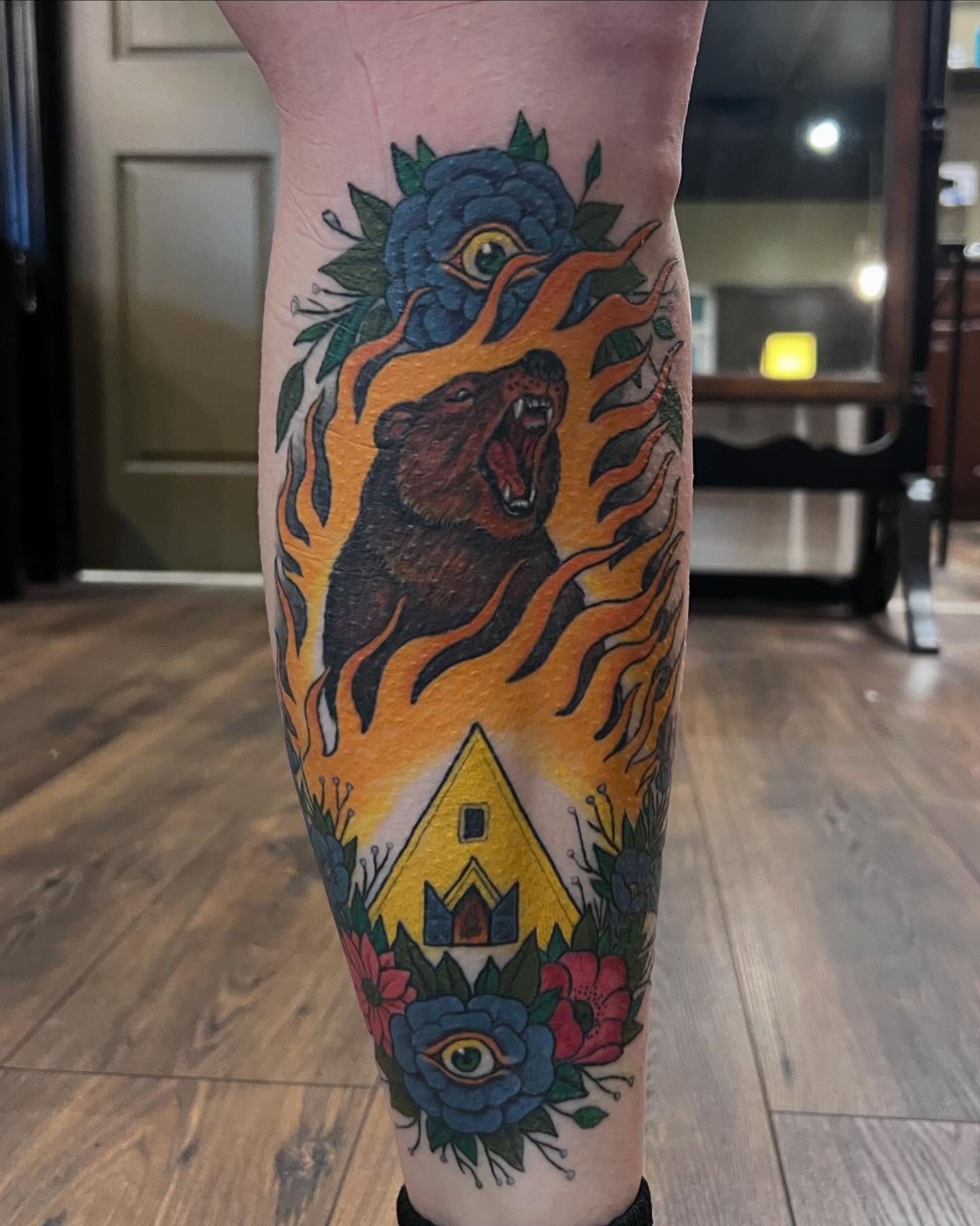 Bear and flames American traditional tattoo on the forearm by Jesse Gray