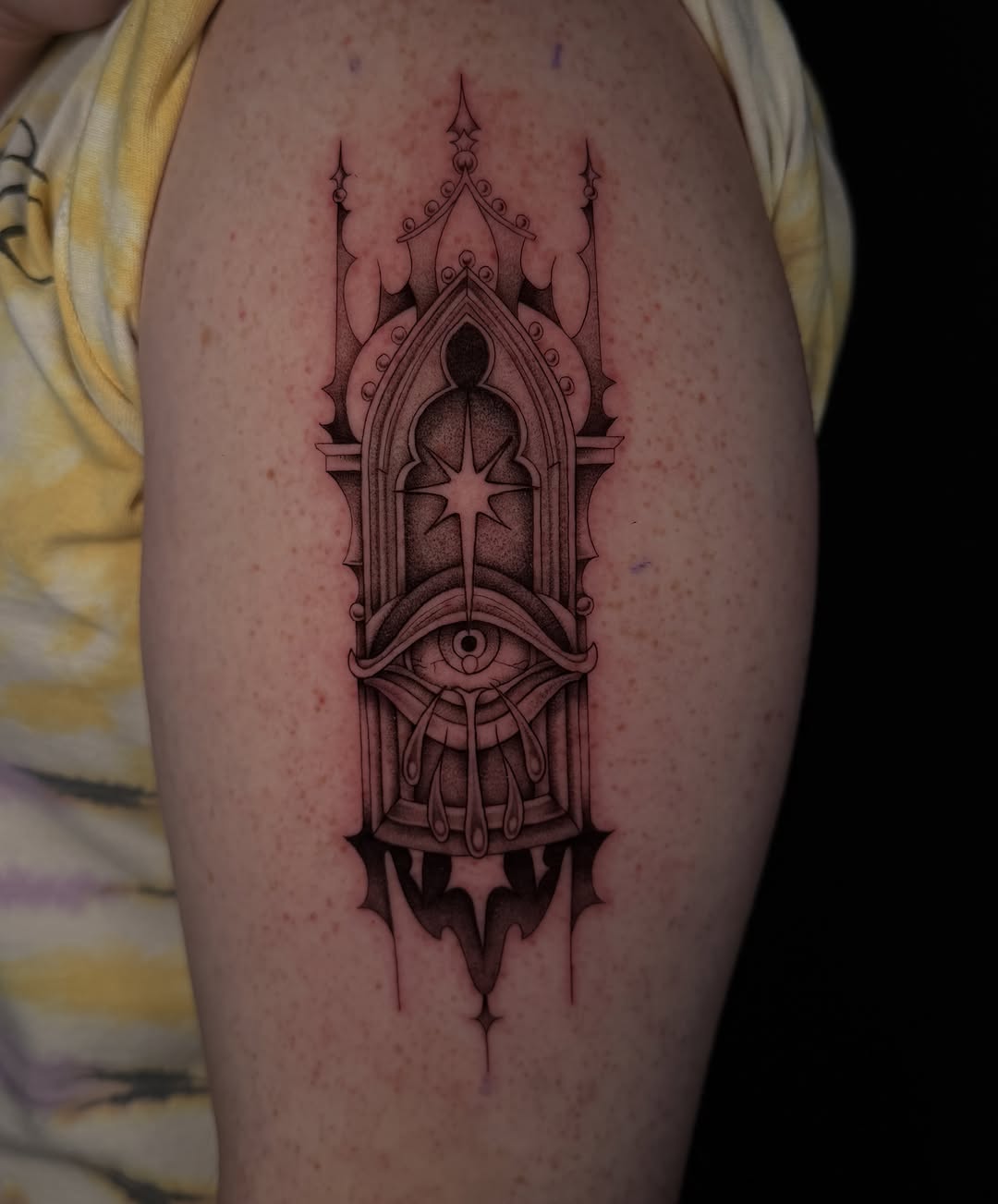 Gothic window with eye dark art tattoo on the shoulder by Marianne