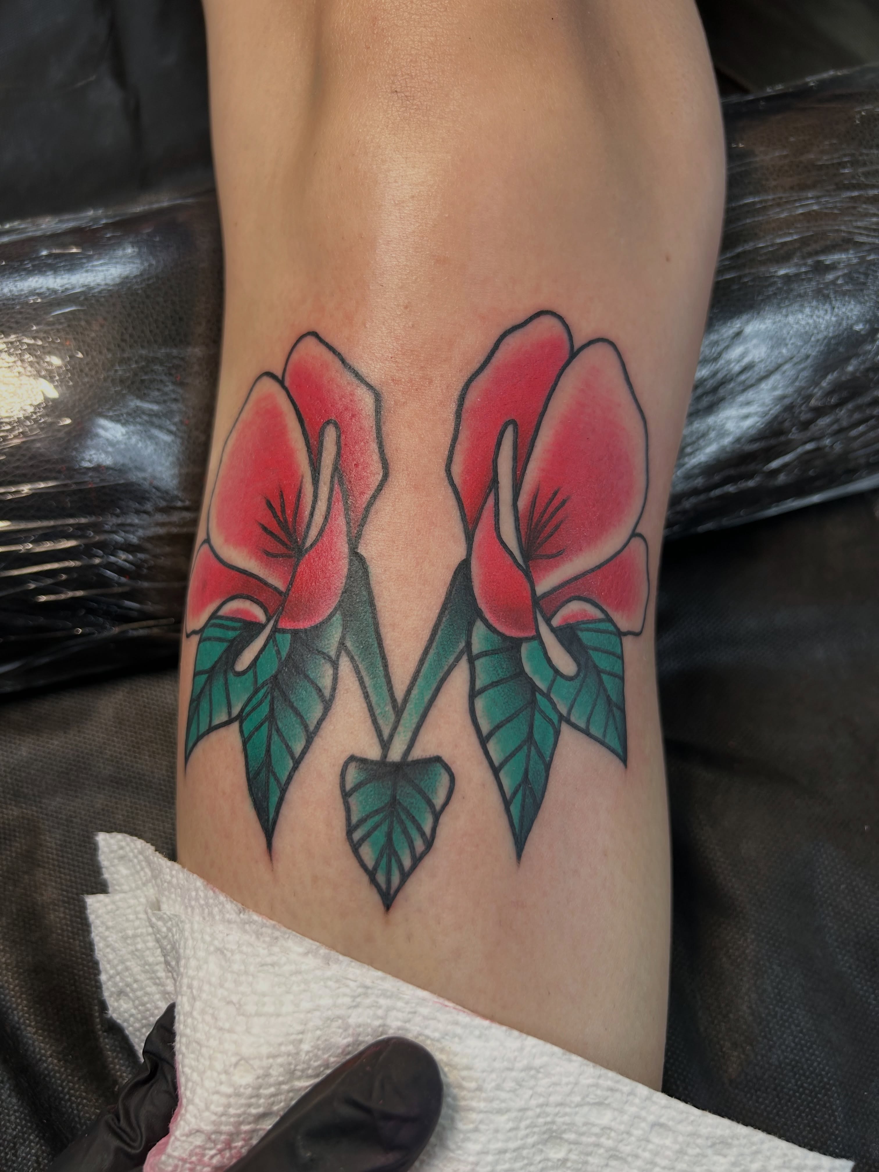 Calla lilies American traditional tattoo on the leg by Tattoos by Corey aka MrLu