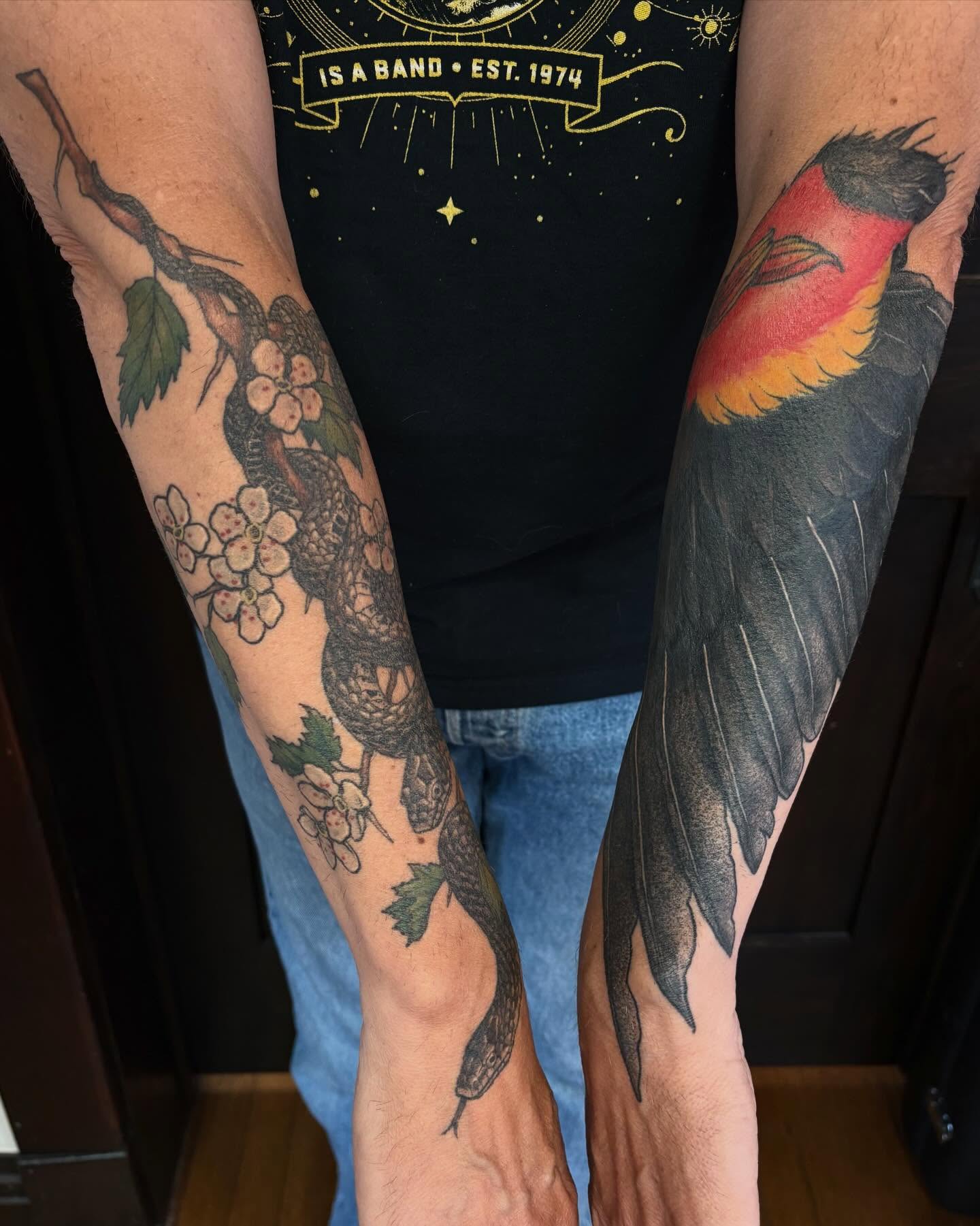 Snake and flowers American traditional tattoo on the forearm by kane