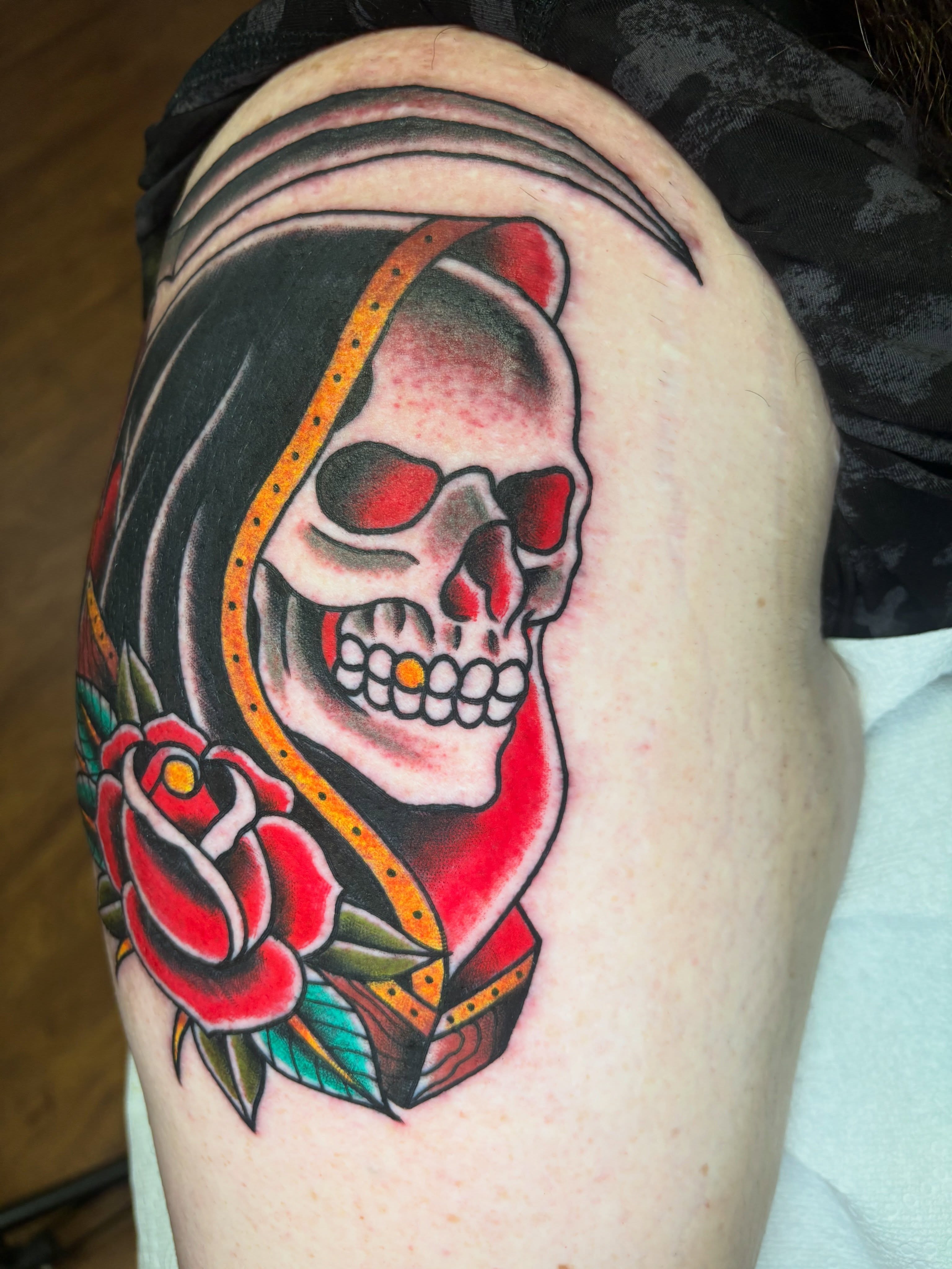 Skull with rose American traditional tattoo on the shoulder by AARON MASTERS - Tattoo Artist