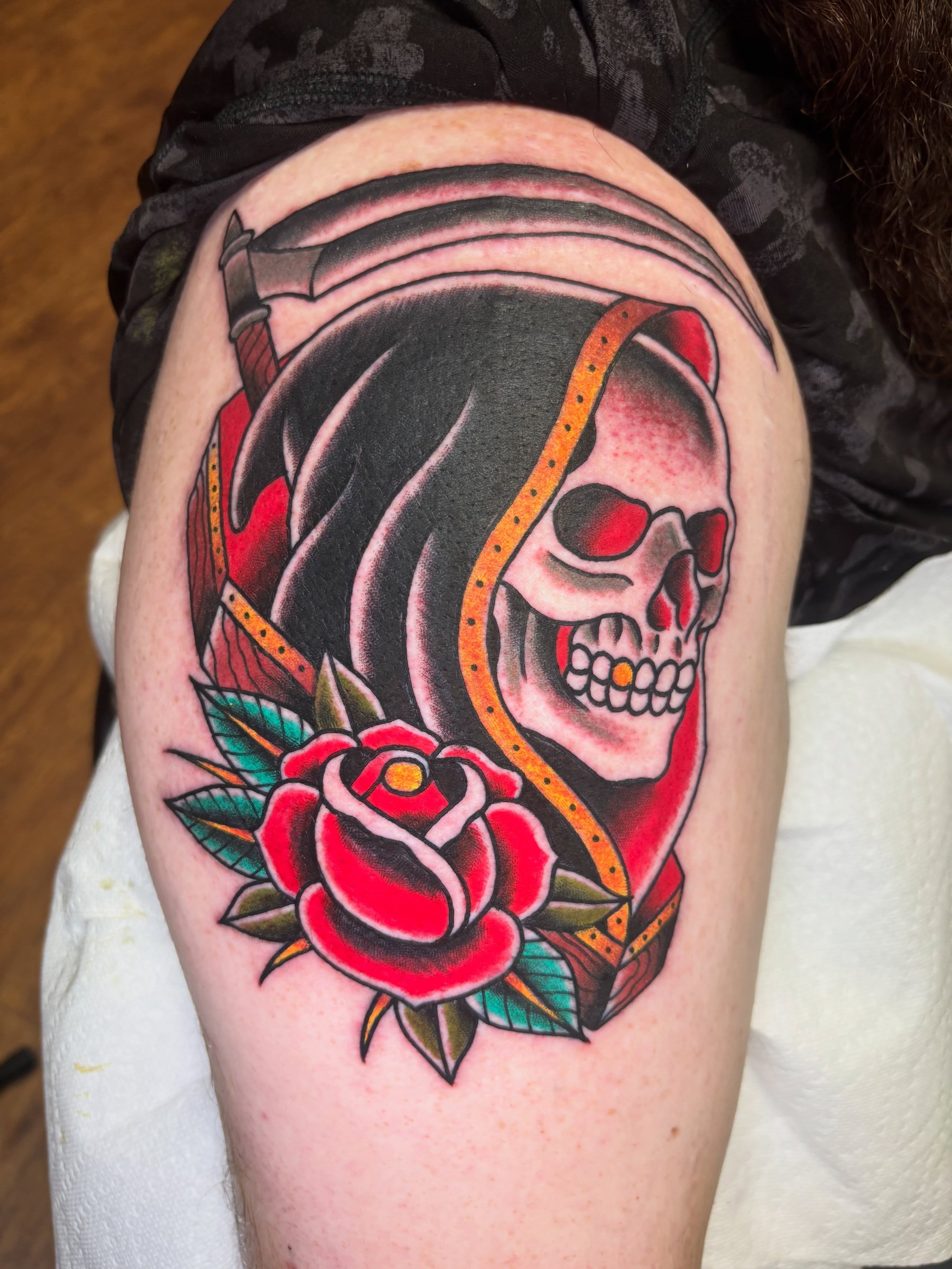 Skull and rose American traditional tattoo on the shoulder by AARON MASTERS - Tattoo Artist