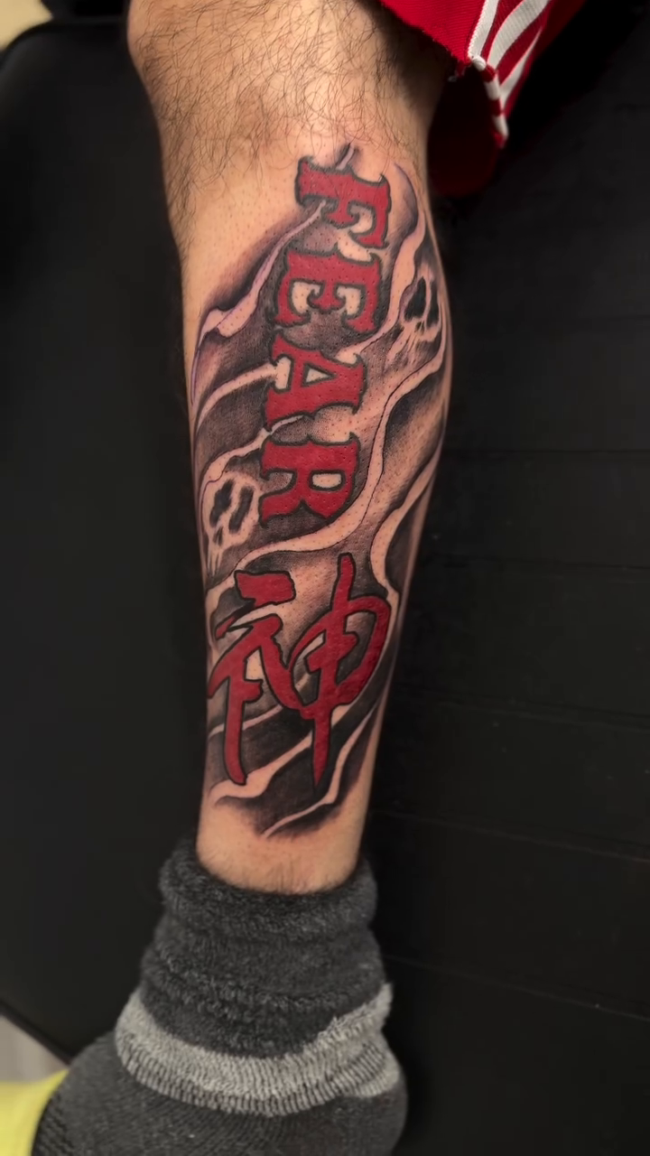 FEAR NO lettering script tattoo by H.G