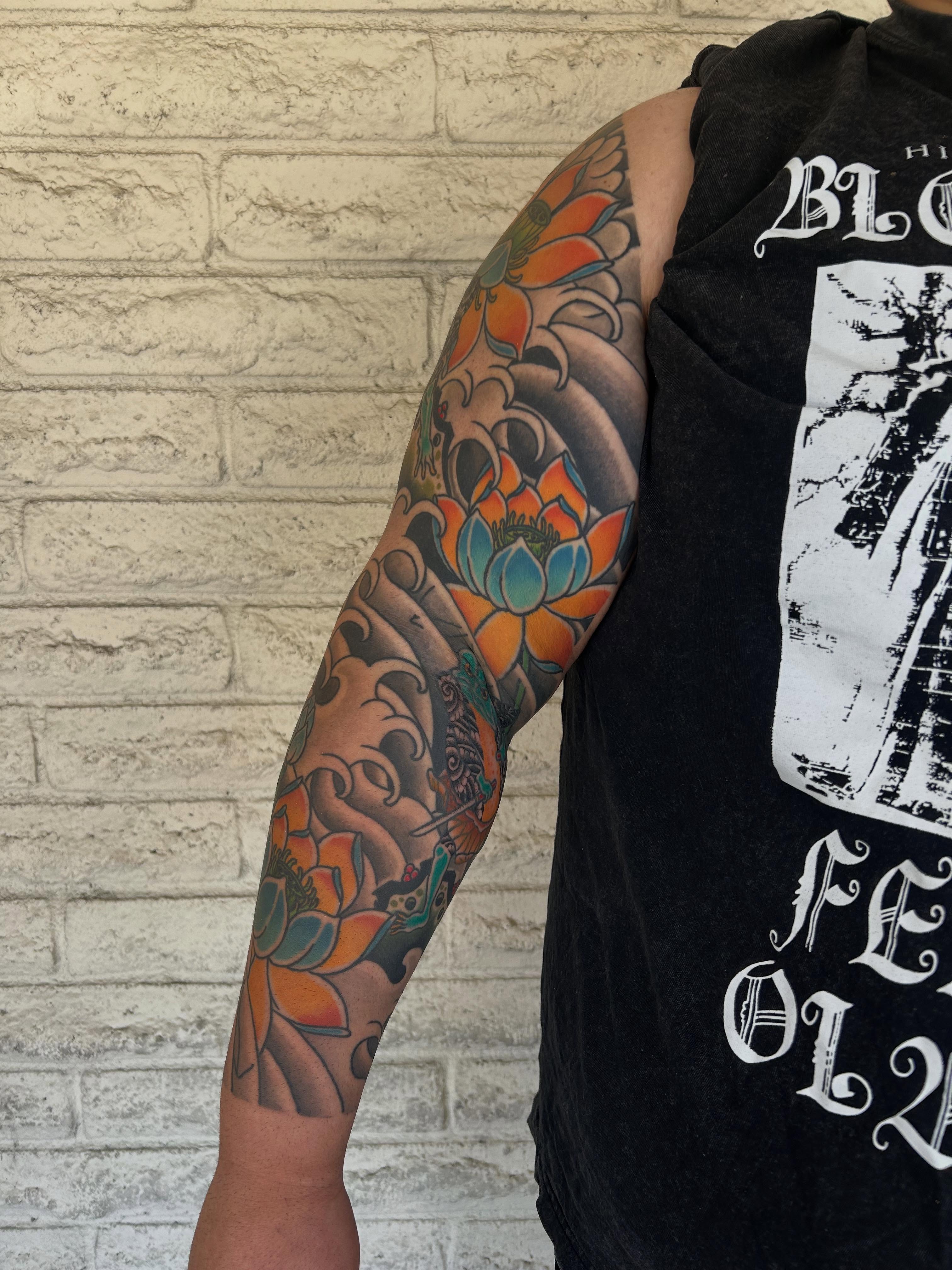 Lotus flower japanese irezumi tattoo on the forearm by Stephen Sanchez