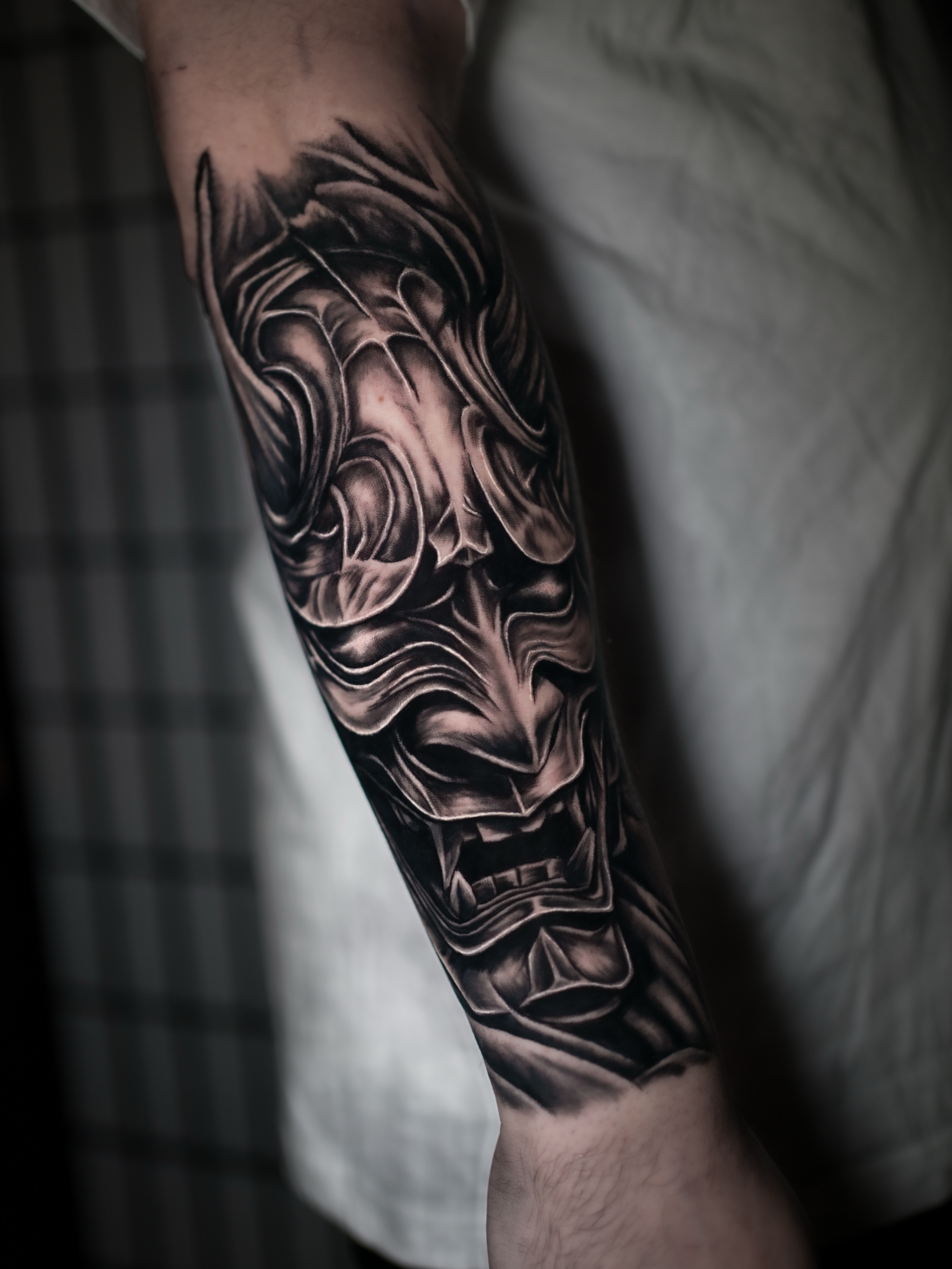 Mask realism tattoo on the forearm by Juan David Arias