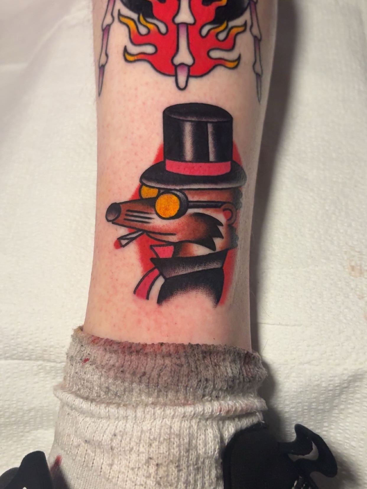 Top hat rat American traditional tattoo on the forearm by Chris Prince Jr., Miamisburg, Ohio