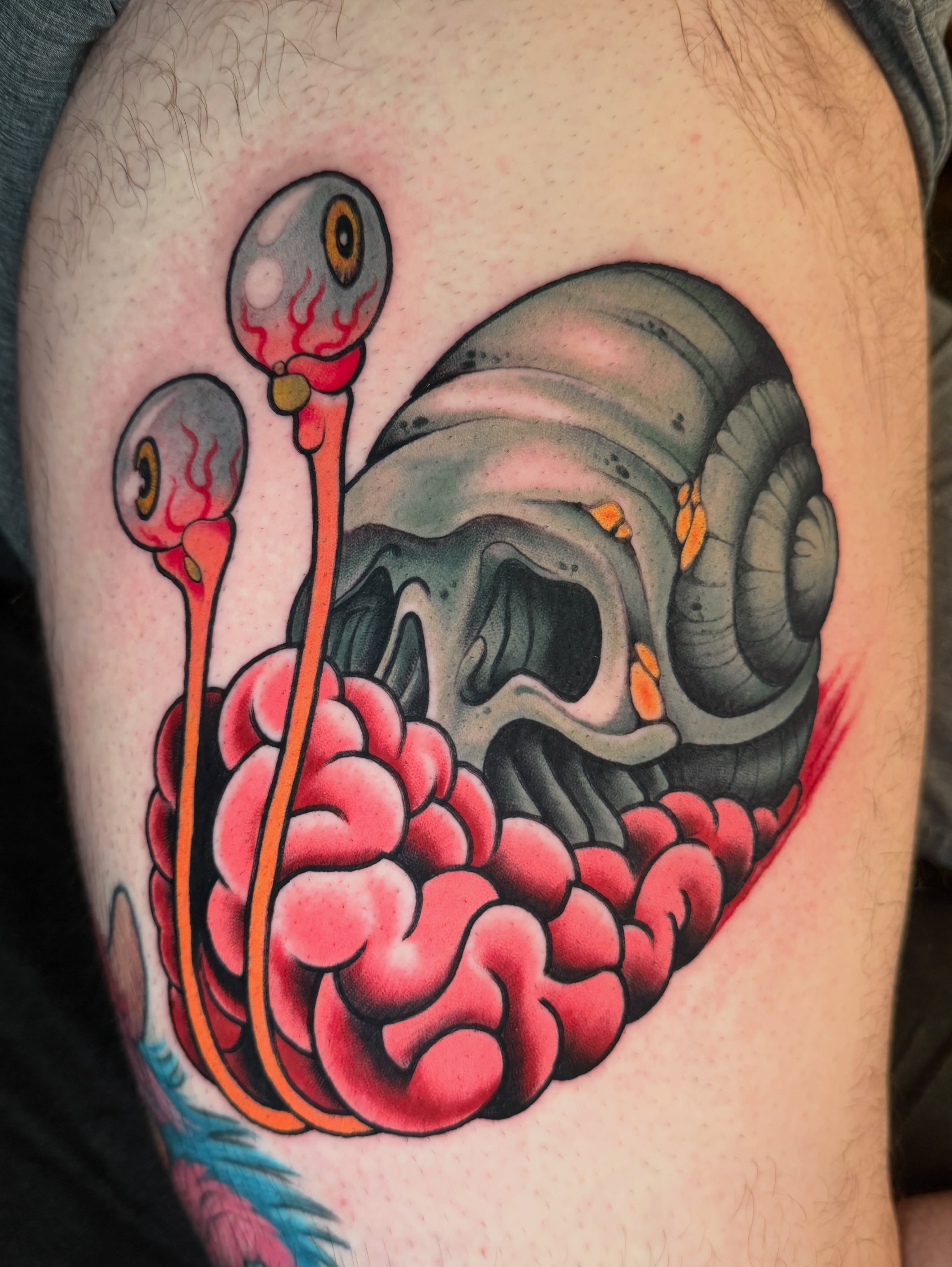 Skull and intestines American traditional tattoo on the thigh by JoshUA Bowers, Des Moines, Iowa