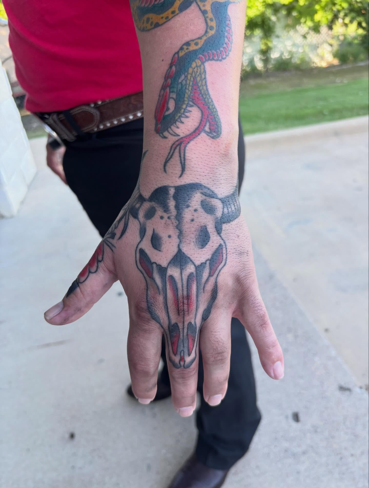 Skull American traditional tattoo on the hand by Ethan Ellis, Dallas, Texas