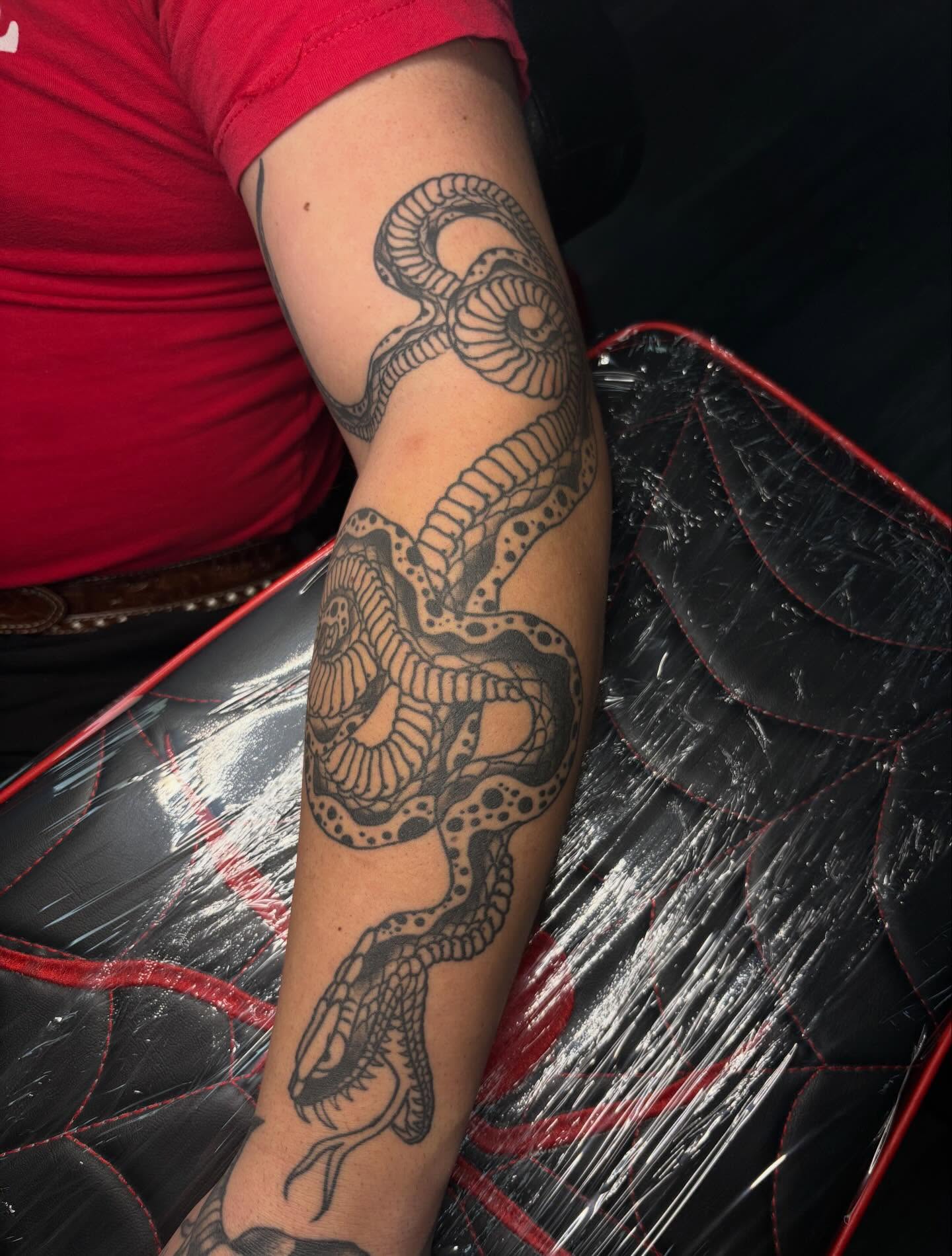 Snake black and grey tattoo on the forearm by Ethan Ellis, Dallas, Texas