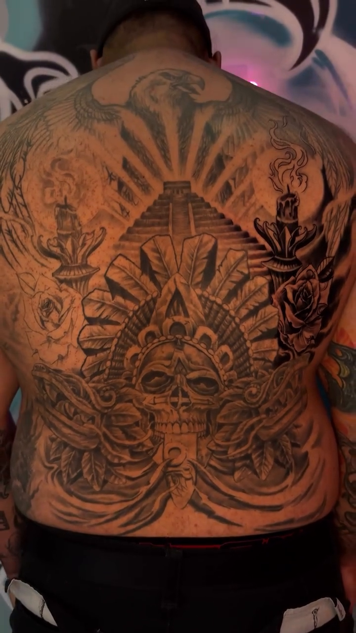 Candle and rose back piece Chicano tattoo on the back by Tony Hernandez, Chicago, Illinois