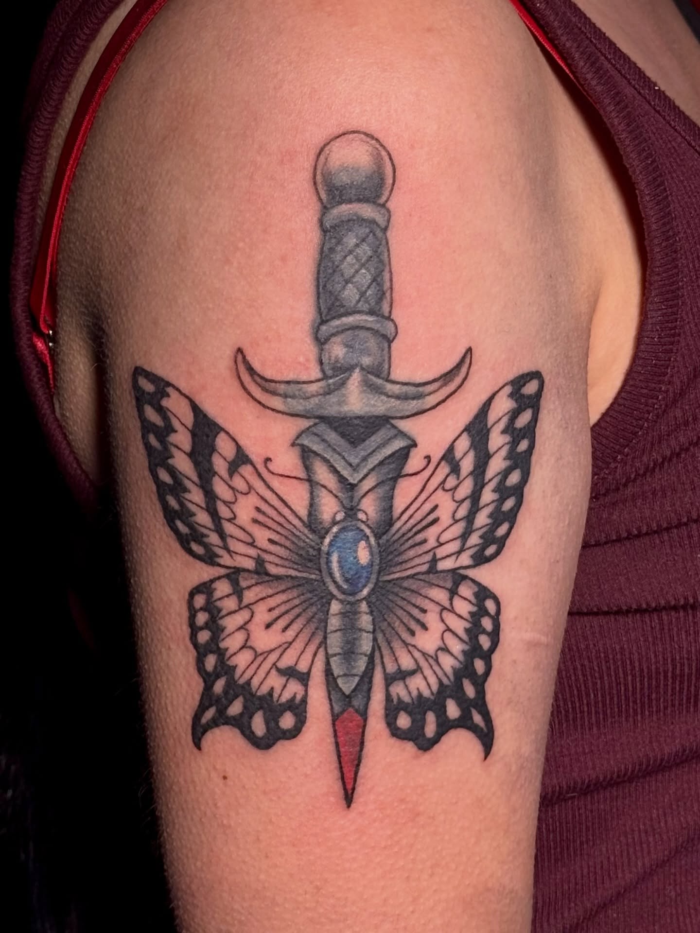 Knife and butterfly American traditional tattoo on the shoulder by Paris Romano