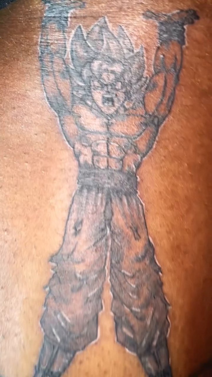 Goku from Dragon Ball Z tattoo on the thigh by The Reelist Ink