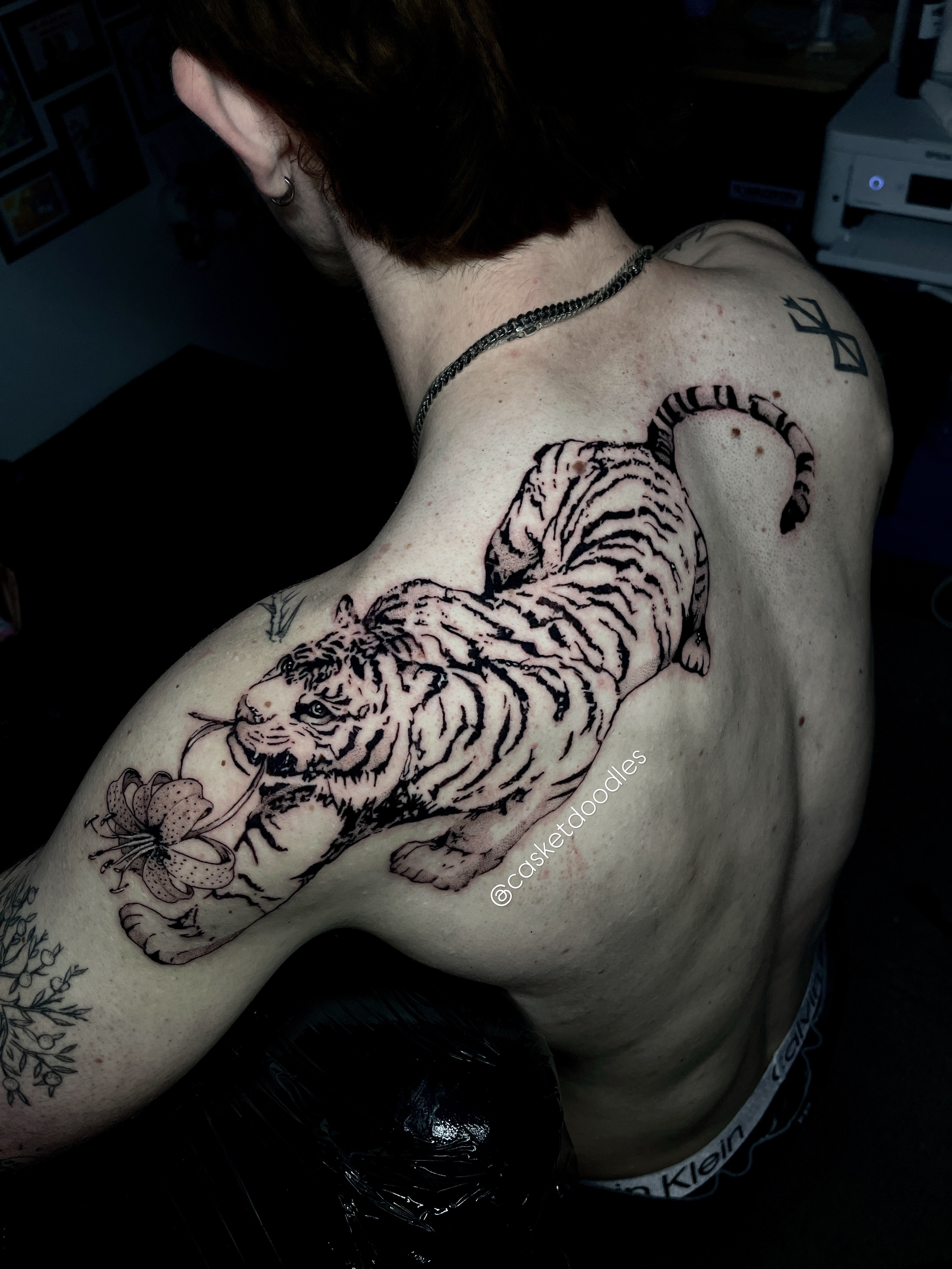 Tiger black and grey tattoo on the back by clarissa