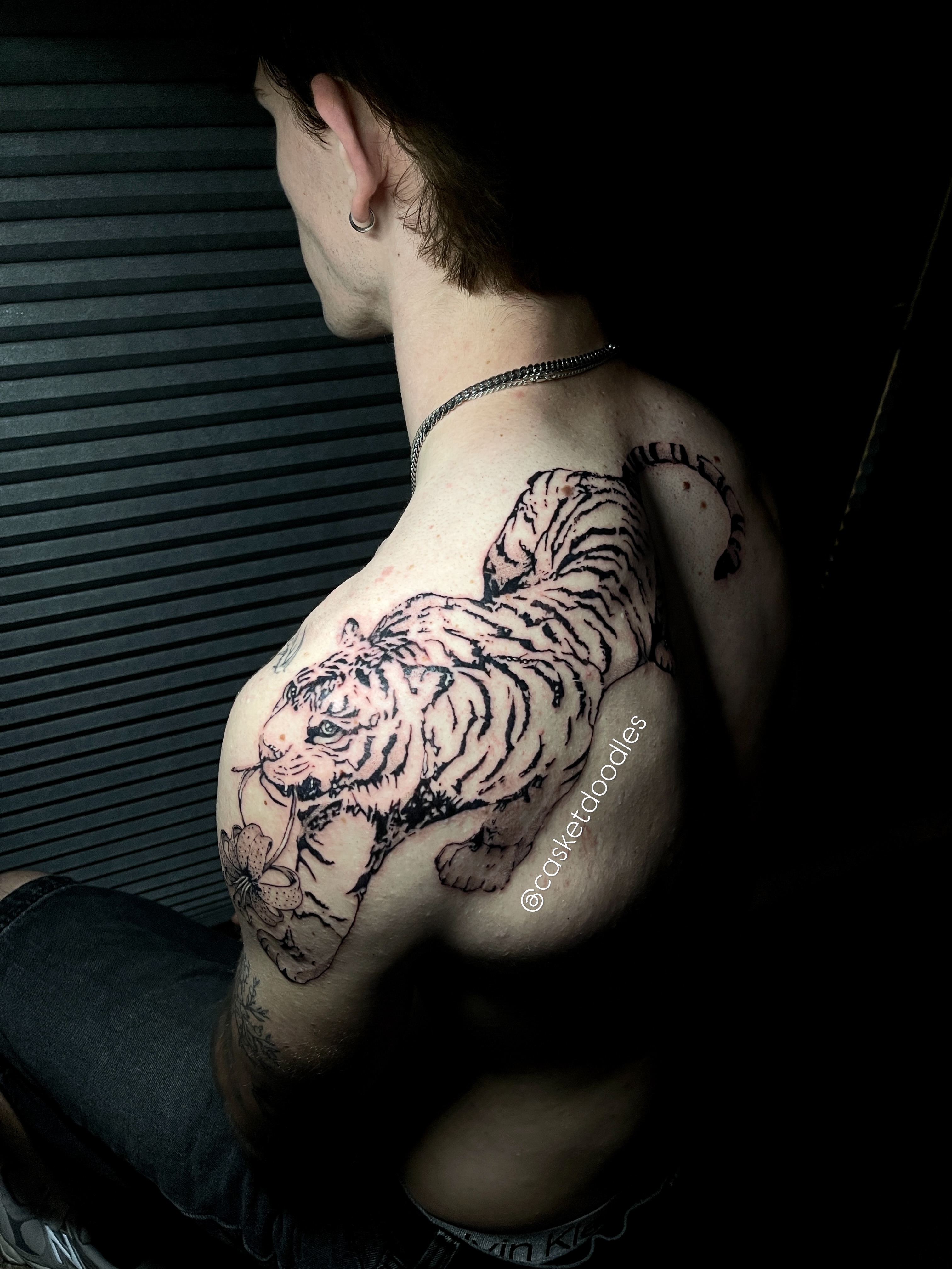Tiger black and grey tattoo on the chest by clarissa