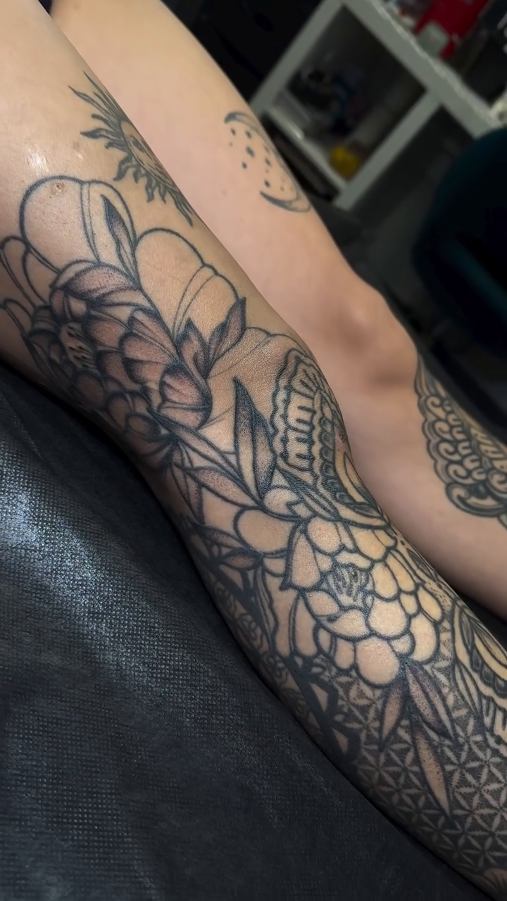 Floral and geometric sleeve tattoo dotwork tattoo on the forearm by Ciera Farni, Murray, Utah
