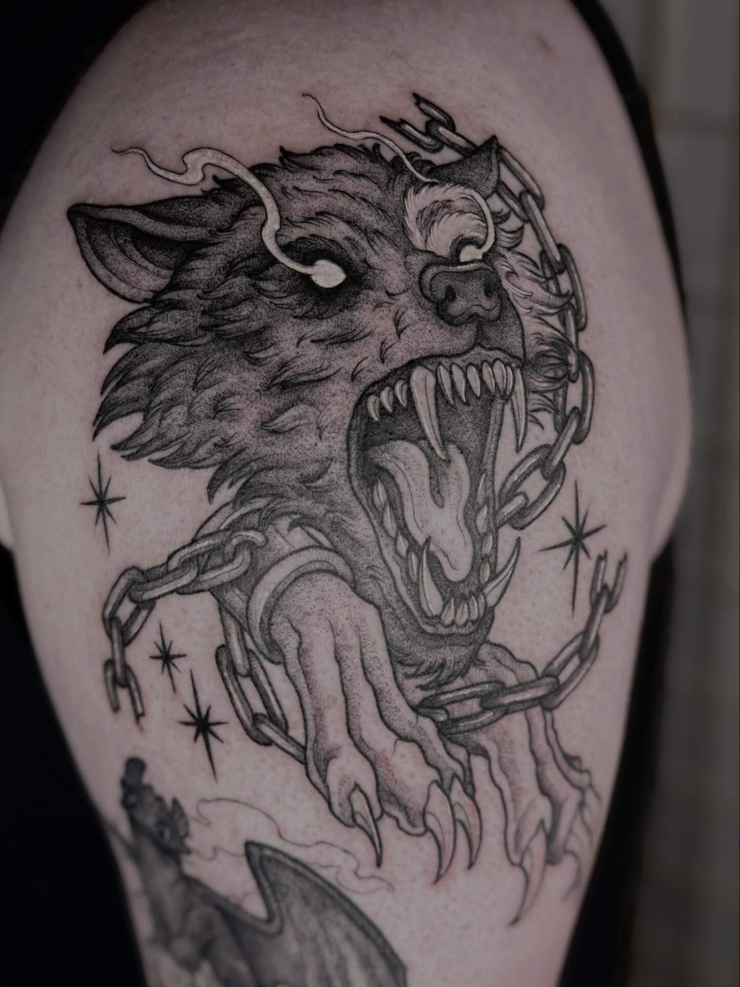 Wolf black and grey tattoo on the shoulder by Cincinnati