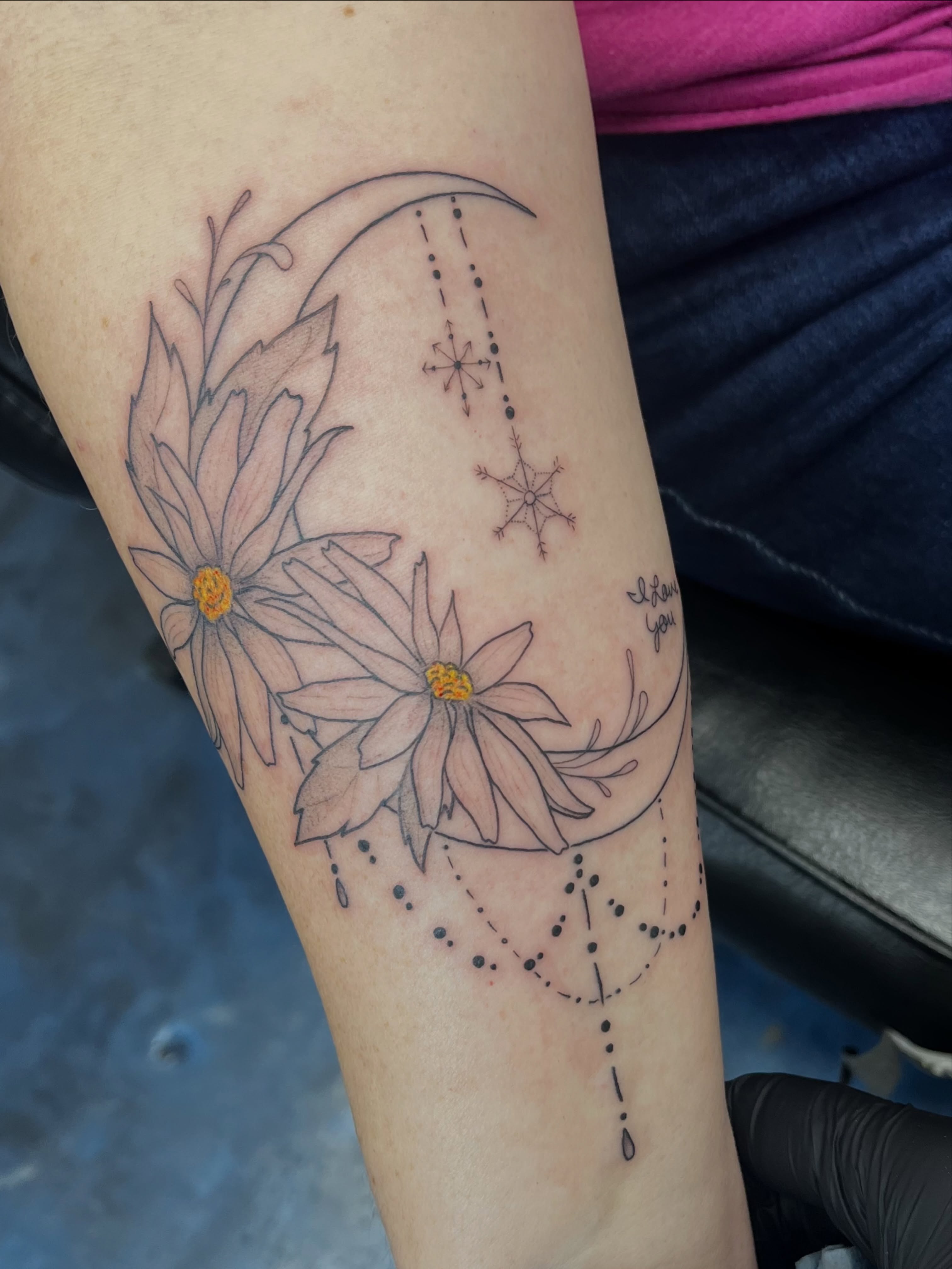 Flowers and crescent moon dotwork tattoo on the forearm by Sid