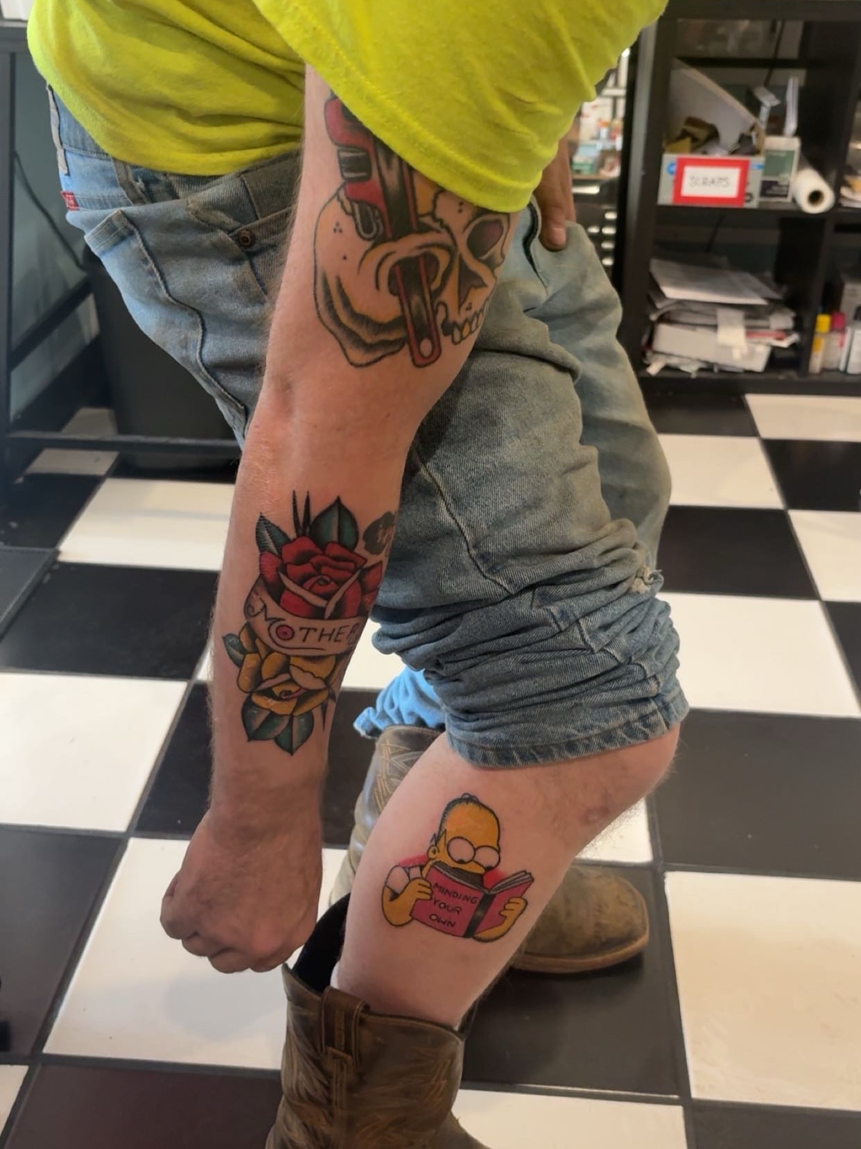 Homer Simpson reading American traditional tattoo on the leg by Chris Prince Jr., Miamisburg, Ohio