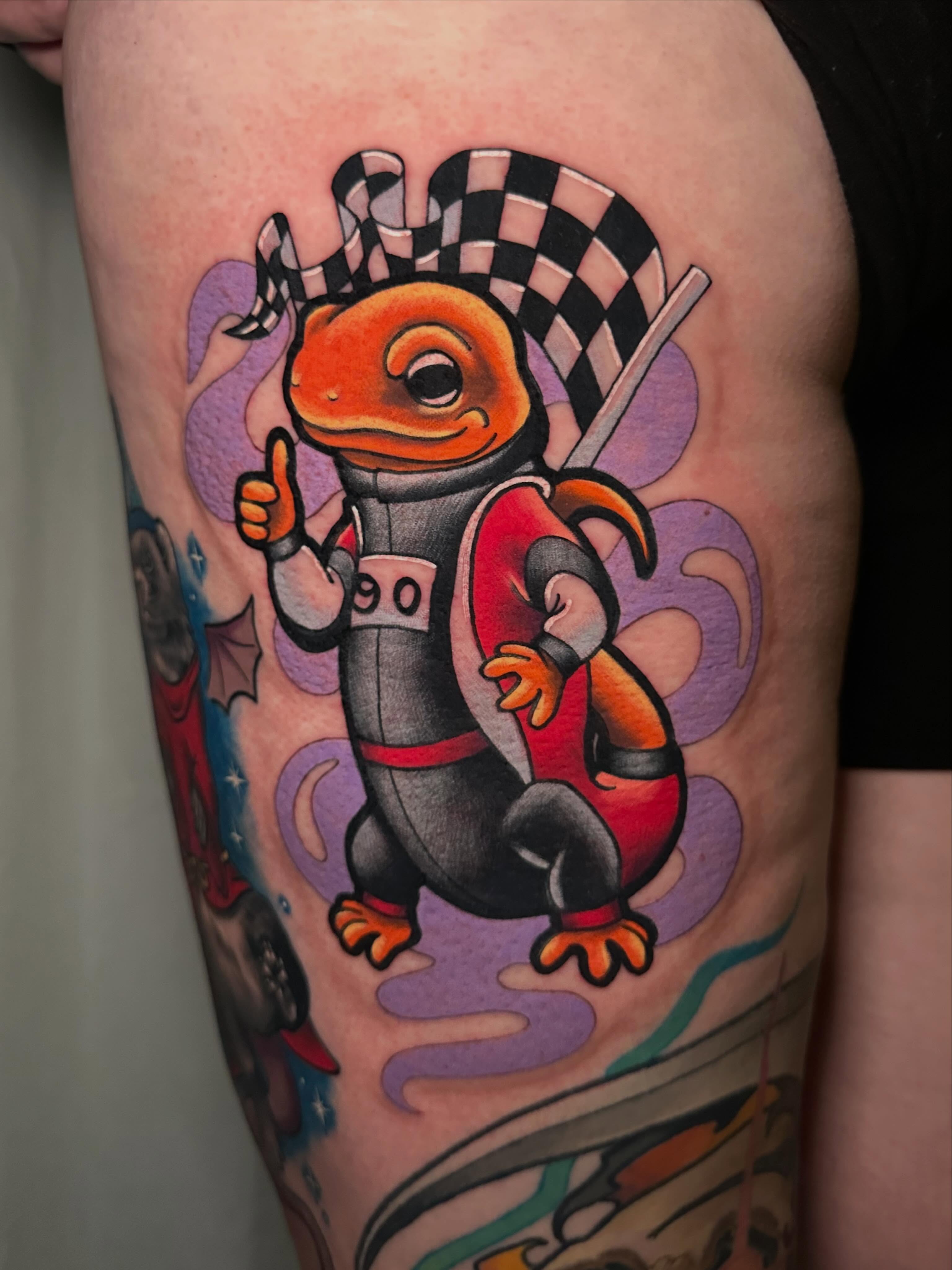 Lizard racer American traditional tattoo on the thigh by 🌿 Vicky Stoner 🌿
